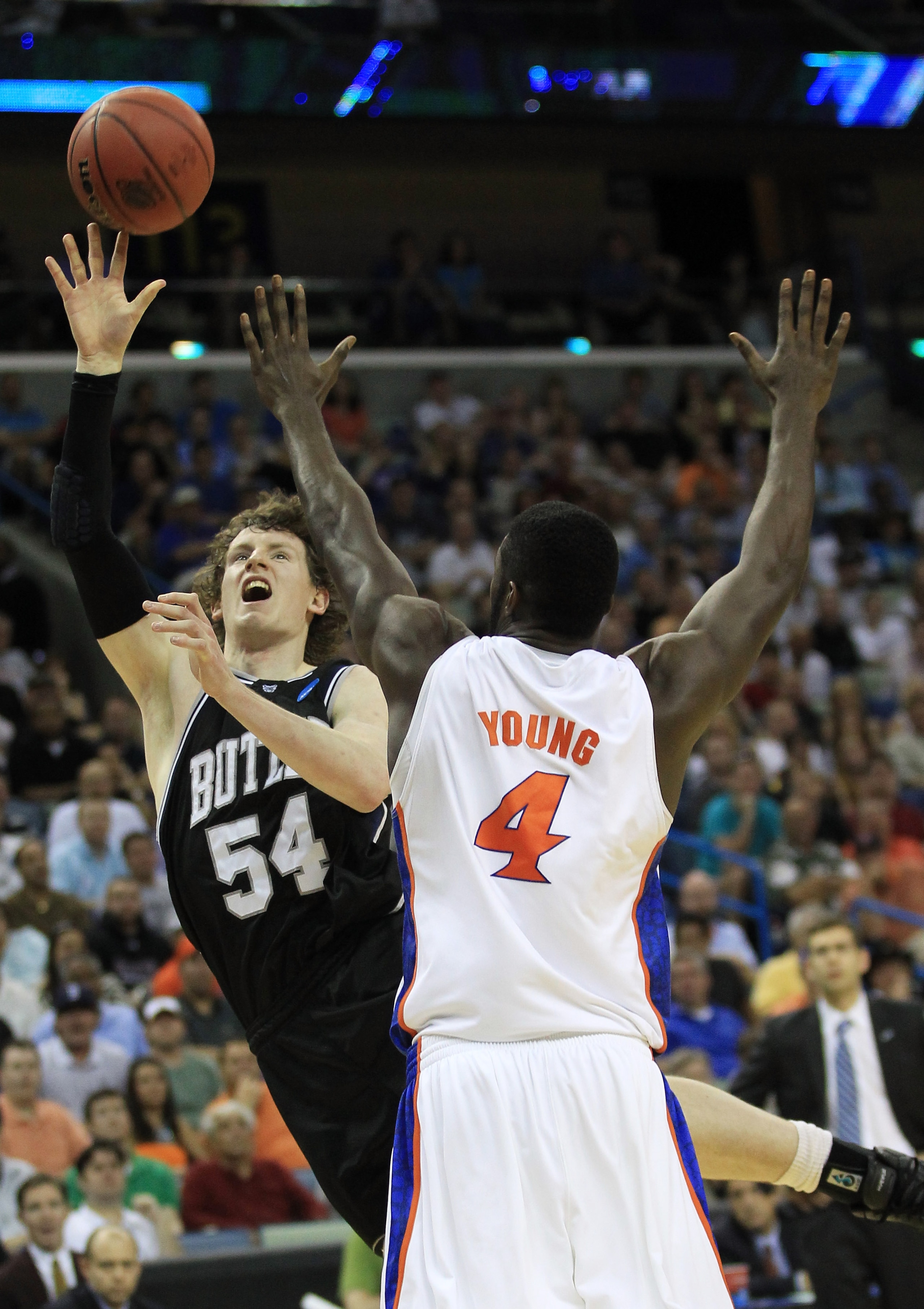 NEW ORLEANS, LA - MARCH 26:  Matt Howard #54 of the Butler Bulldogs shoots over Patric Young #4 of the Florida Gators in the second half during the Southeast regional final of the 2011 NCAA men's basketball tournament at New Orleans Arena on March 26, 201