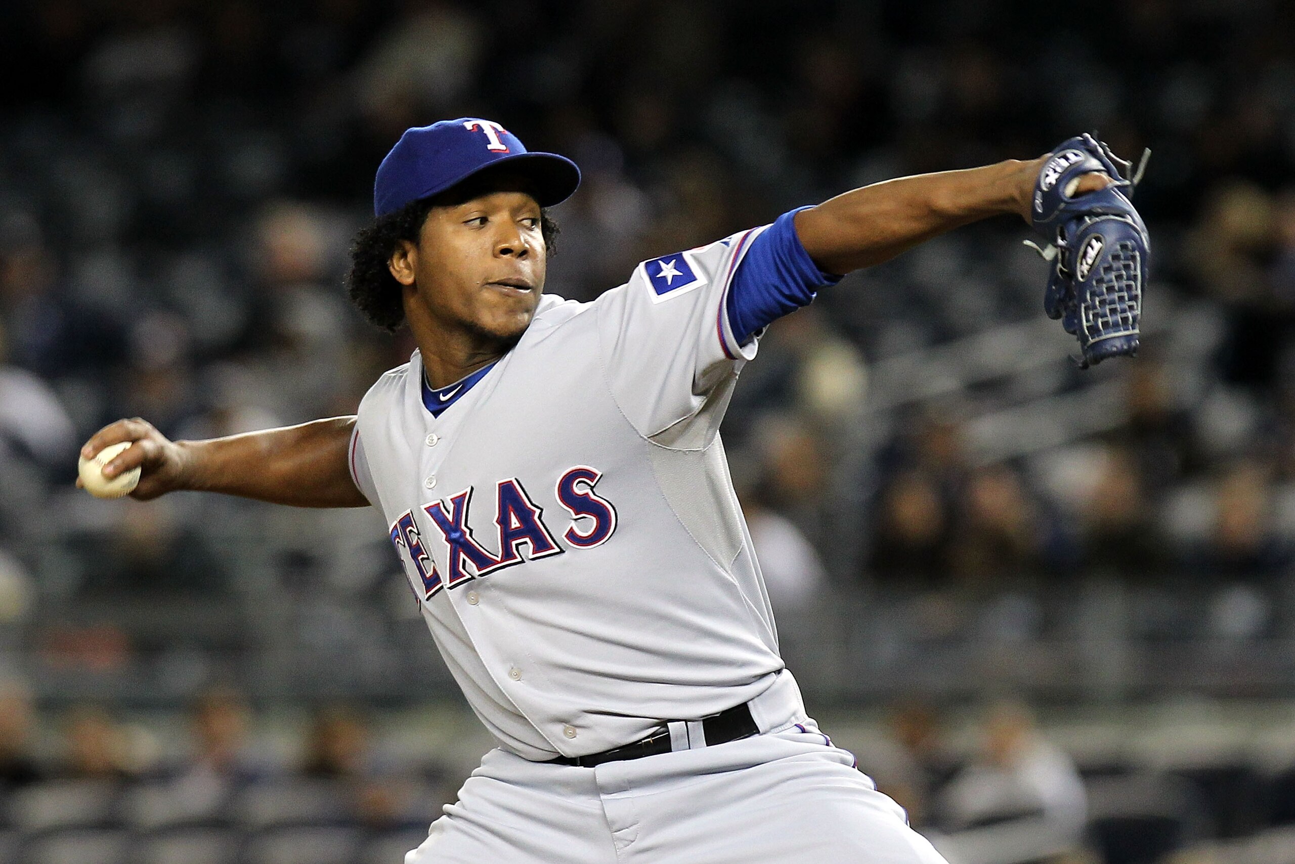 NEW YORK - OCTOBER 18:  Neftali Feliz #30 ofthe Texas Rangers pitches against the New York Yankees in Game Three of the ALCS during the 2010 MLB Playoffs at Yankee Stadium on October 18, 2010 in New York, New York. The Rangers won 8-0.  (Photo by Nick Lah