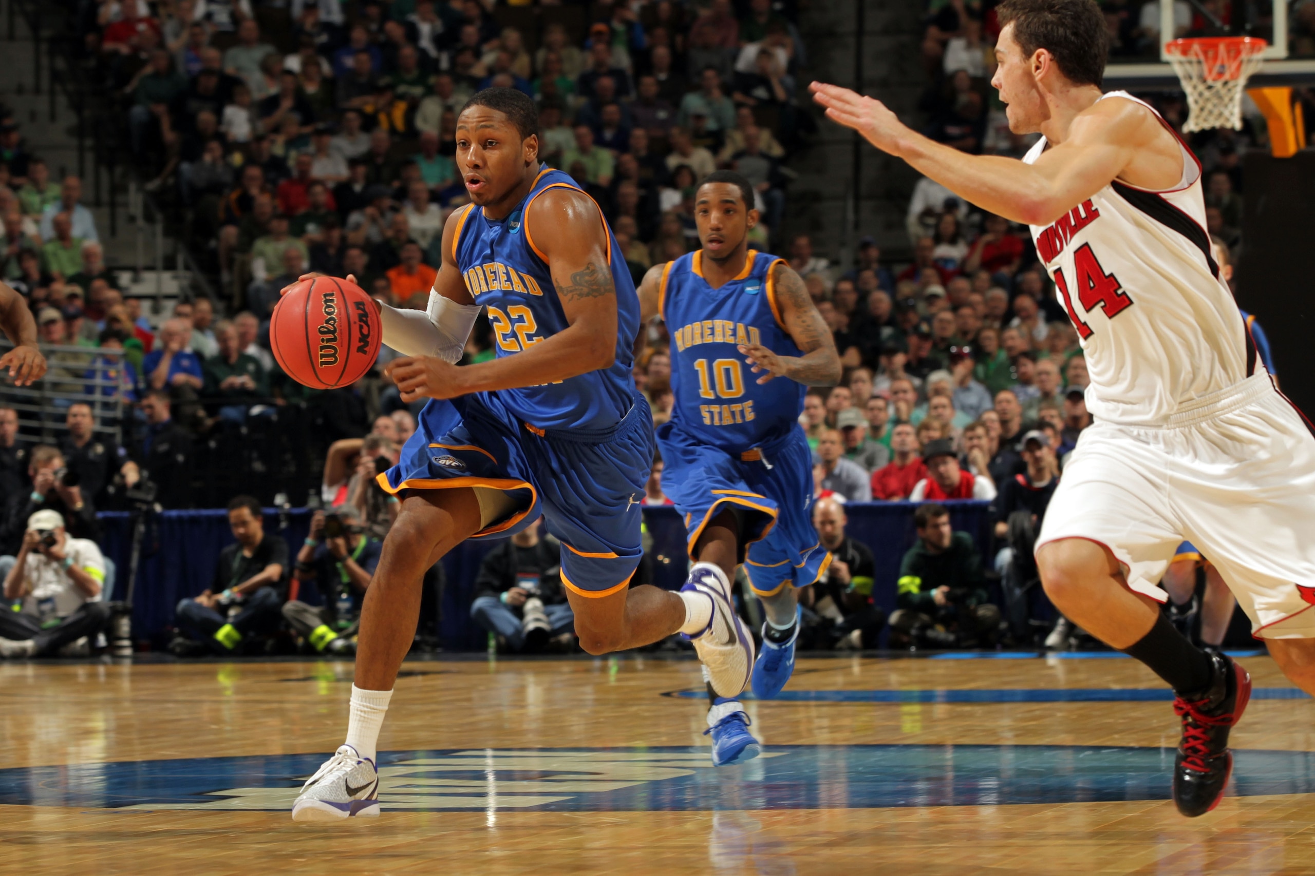 DENVER, CO - MARCH 17:  Demonte Harper #22 of the Morehead State Eagles handles the ball against the Louisville Cardinals during the second round of the 2011 NCAA men's basketball tournament at Pepsi Center on March 17, 2011 in Denver, Colorado.  (Photo b