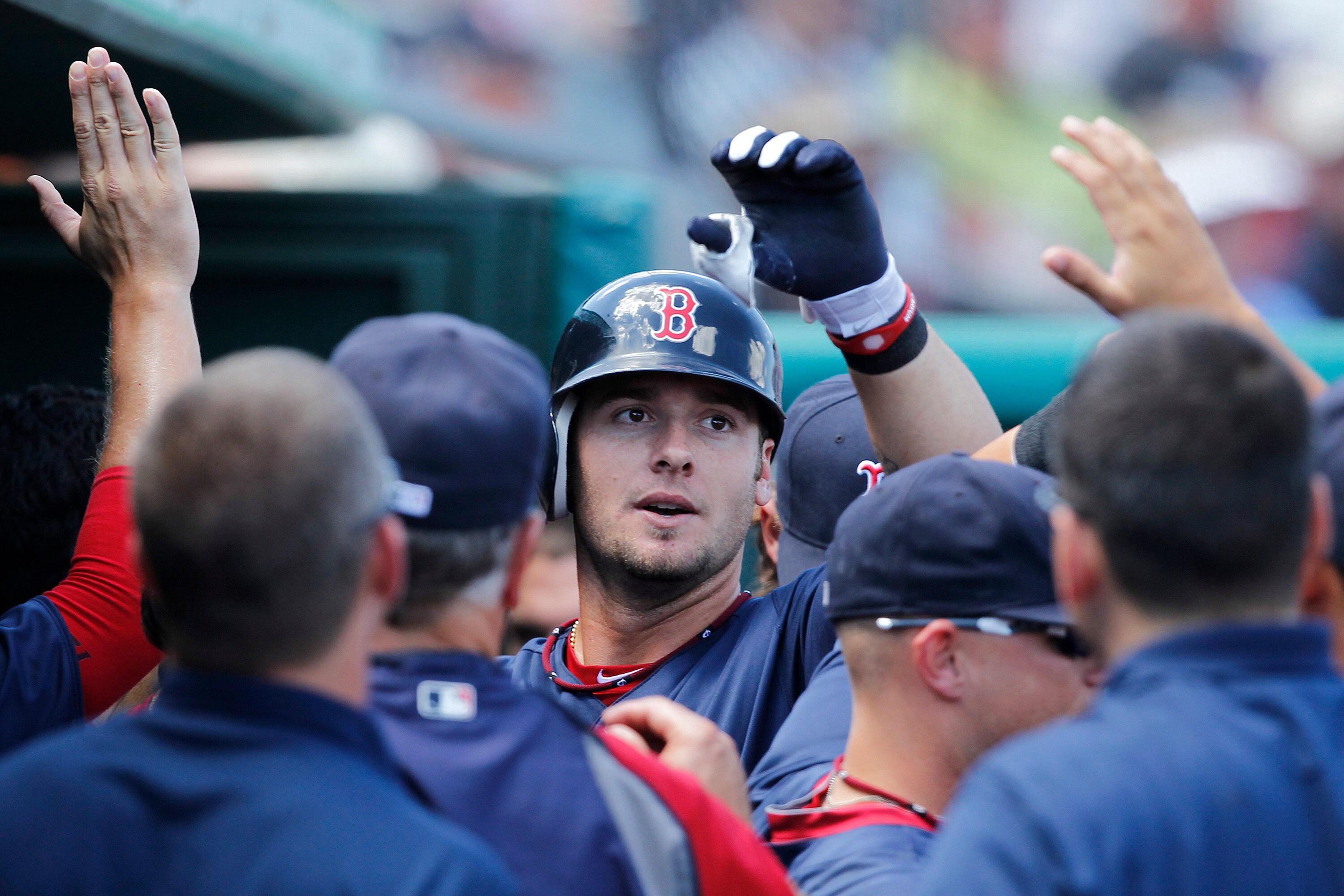 JUPITER, FL - MARCH 24: Jarrod Saltalamacchia #39 of the Boston Red Sox is congratulated by teammates after hitting a home run against the Florida Marlins at Roger Dean Stadium on March 24, 2011 in Jupiter, Florida. The Marlins defeated the Red Sox 15-7.