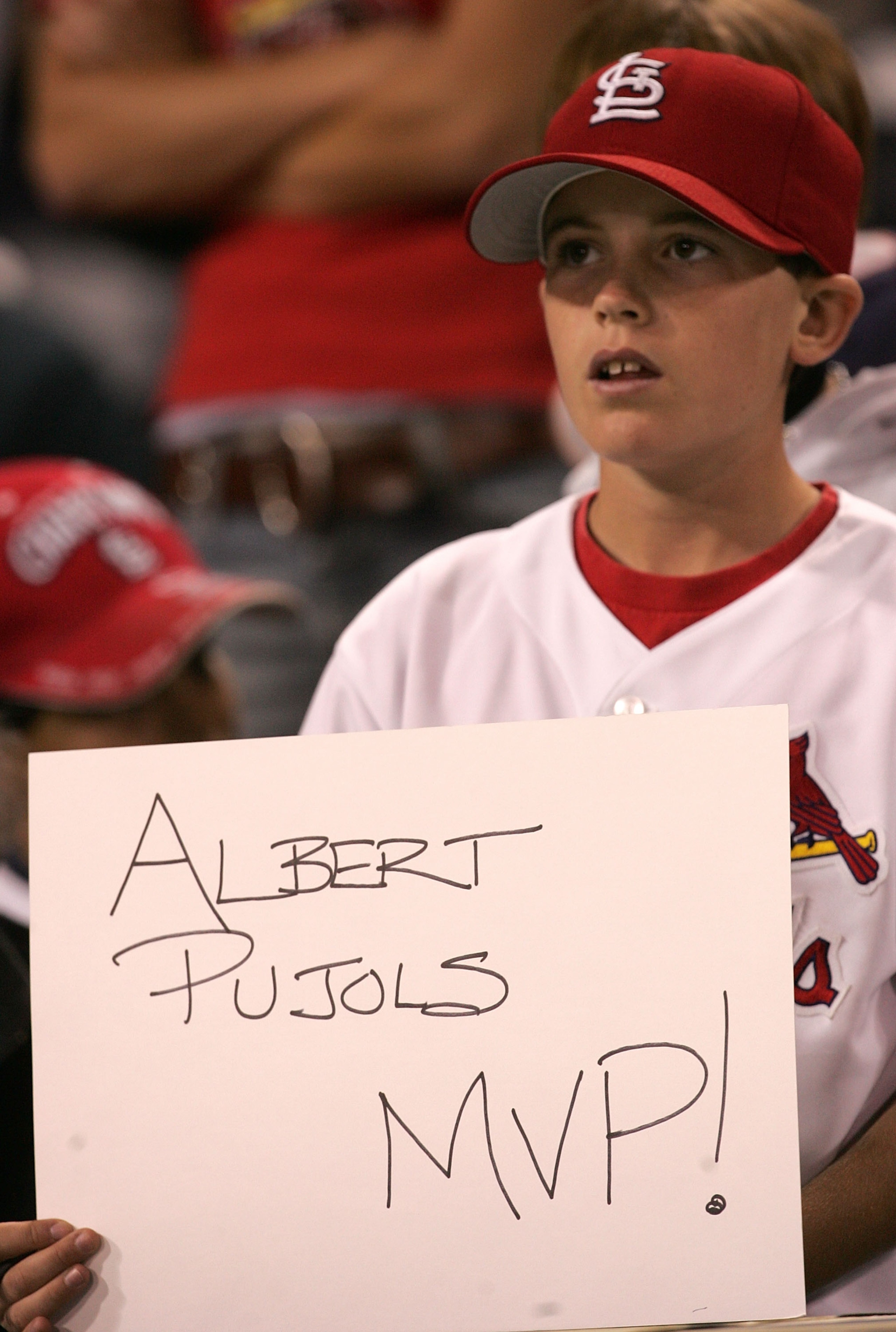 SAN DIEGO - OCTOBER 08:  A young St. Louis Cardinals fan holds up a sign that reads 'Albert Pujols MVP!' during Game Three of the 2005 National League Division Series against the San Diego Padres   on October 8, 2005 at Petco Park in San Diego, California