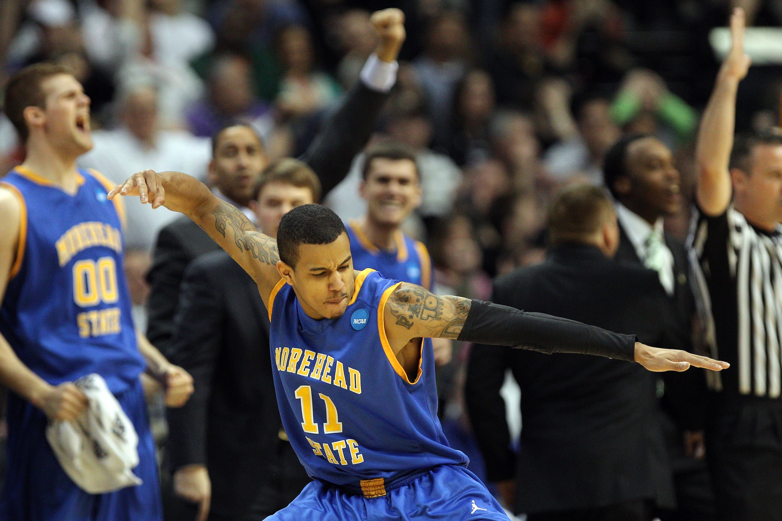 DENVER, CO - MARCH 17:  Terrance Hill #11 of the Morehead State Eagles reacts after hitting a three pointer in the second half against the Louisville Cardinals during the second round of the 2011 NCAA men's basketball tournament at Pepsi Center on March 1