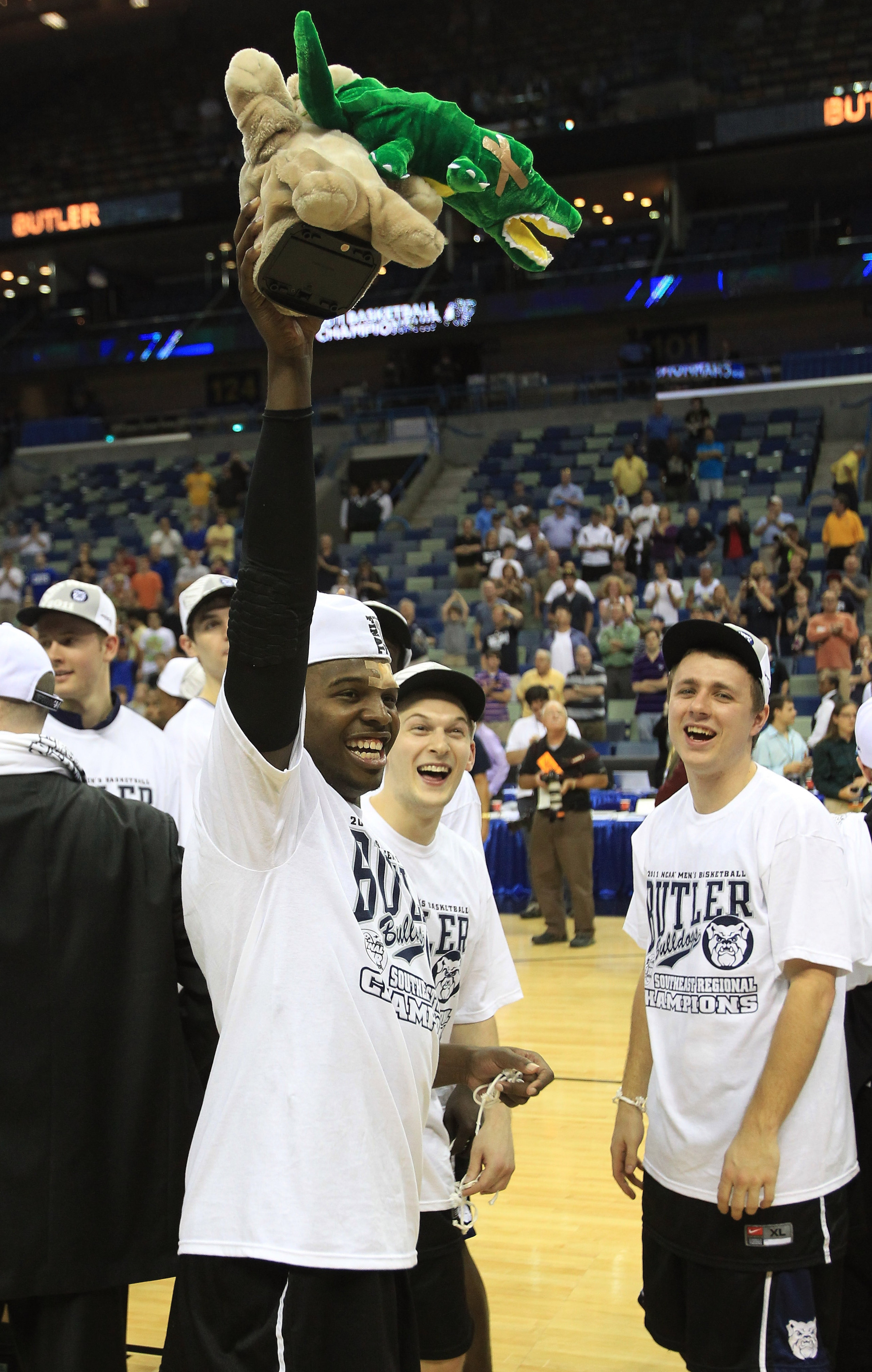NEW ORLEANS, LA - MARCH 26:  Shelvin Mack #1 of the Butler Bulldogs holds a stuffed animal bulldog eating a gator as he celebrates after they defeated the Florida Gators 74 to 71 during the Southeast regional final of the 2011 NCAA men's basketball tourna