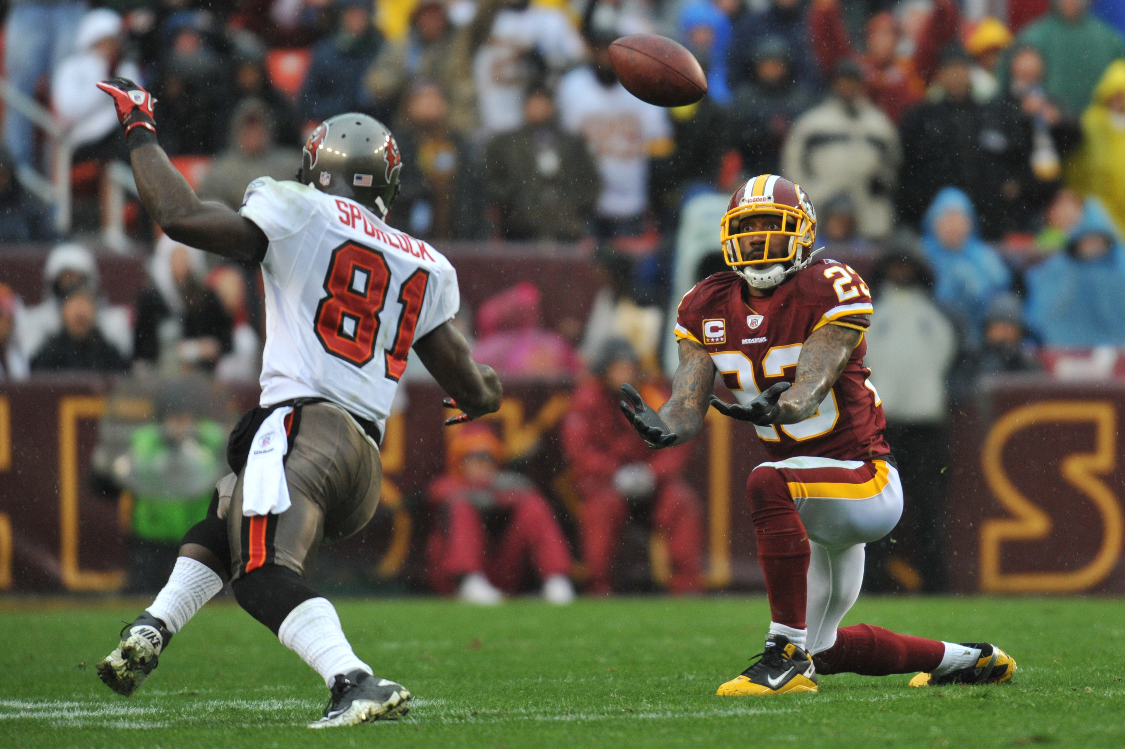 LANDOVER, MD - DECEMBER 12:  DeAngelo Hall #23 of the Washington Redskins tries for an interception against the Tampa Bay Buccaneers  at FedExField on December 12, 2010 in Landover, Maryland. The Buccaneers defeated the Redskins 17-16. (Photo by Larry Fre