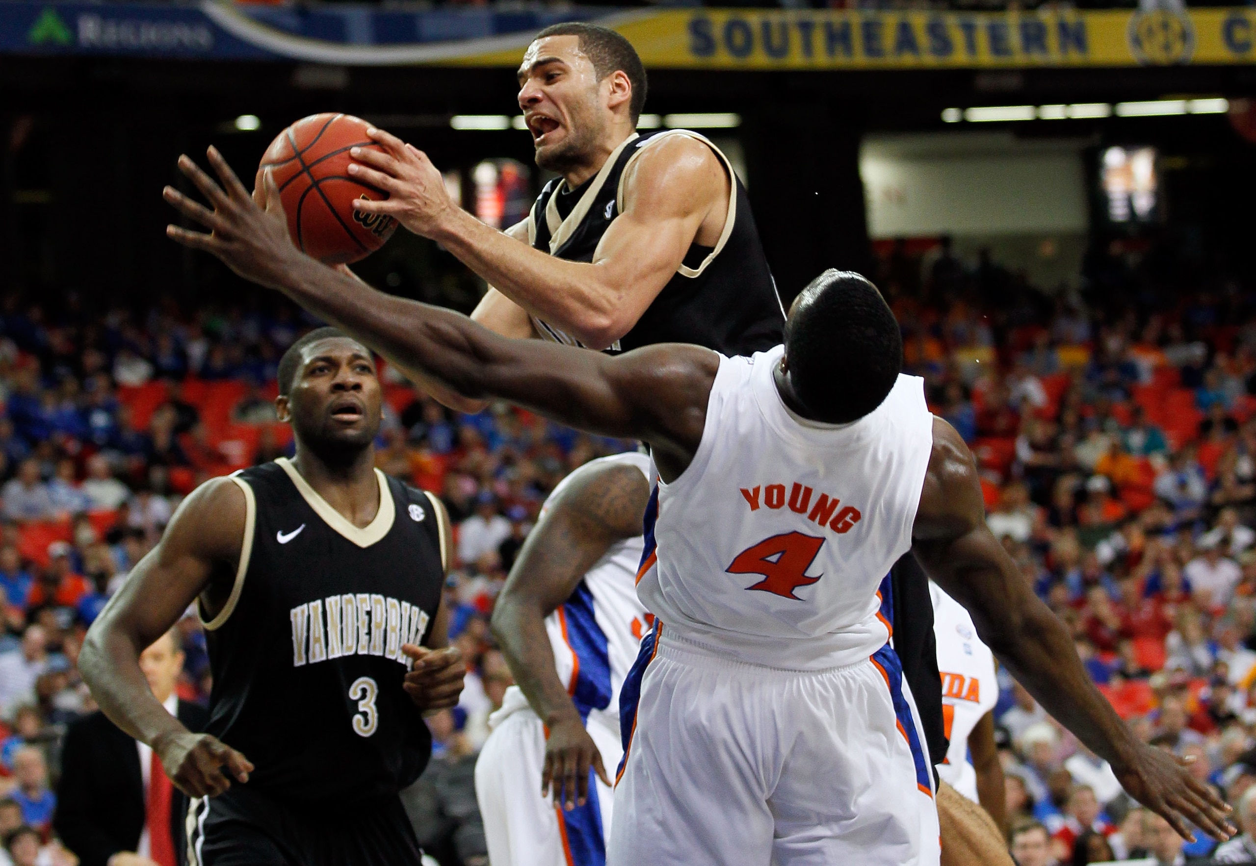 ATLANTA, GA - MARCH 12: Jeffery Taylor #44 of the Vanderbilt Commodores goes up for a shot against Patric Young #4 of the Florida Gators during the semifinals of the SEC Men's Basketball Tournament at Georgia Dome on March 12, 2011 in Atlanta, Georgia. ATLANTA, GA - MARCH 12: Jeffery Taylor #44 of the Vanderbilt Commodores goes up for a shot against Patric Young #4 of the Florida Gators during the semifinals of the SEC Men's Basketball Tournament at Georgia Dome on March 12, 2011 in Atlanta, Georgia.
