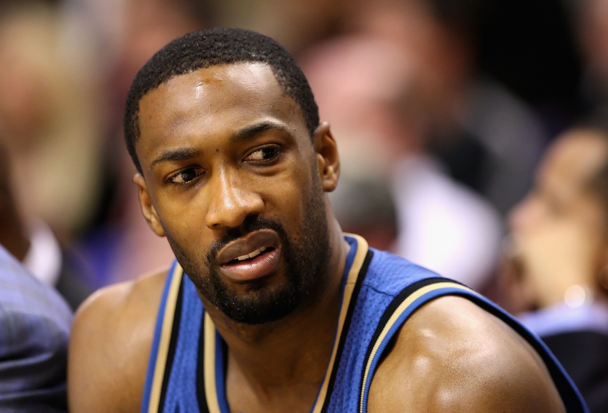 PHOENIX - DECEMBER 19:  Gilbert Arenas #0 of the Washington Wizards sits on the bench during the NBA game against the Phoenix Suns at US Airways Center on December 19, 2009 in Phoenix, Arizona. The Suns defeated the Wizards 121-95. NOTE TO USER: User expr