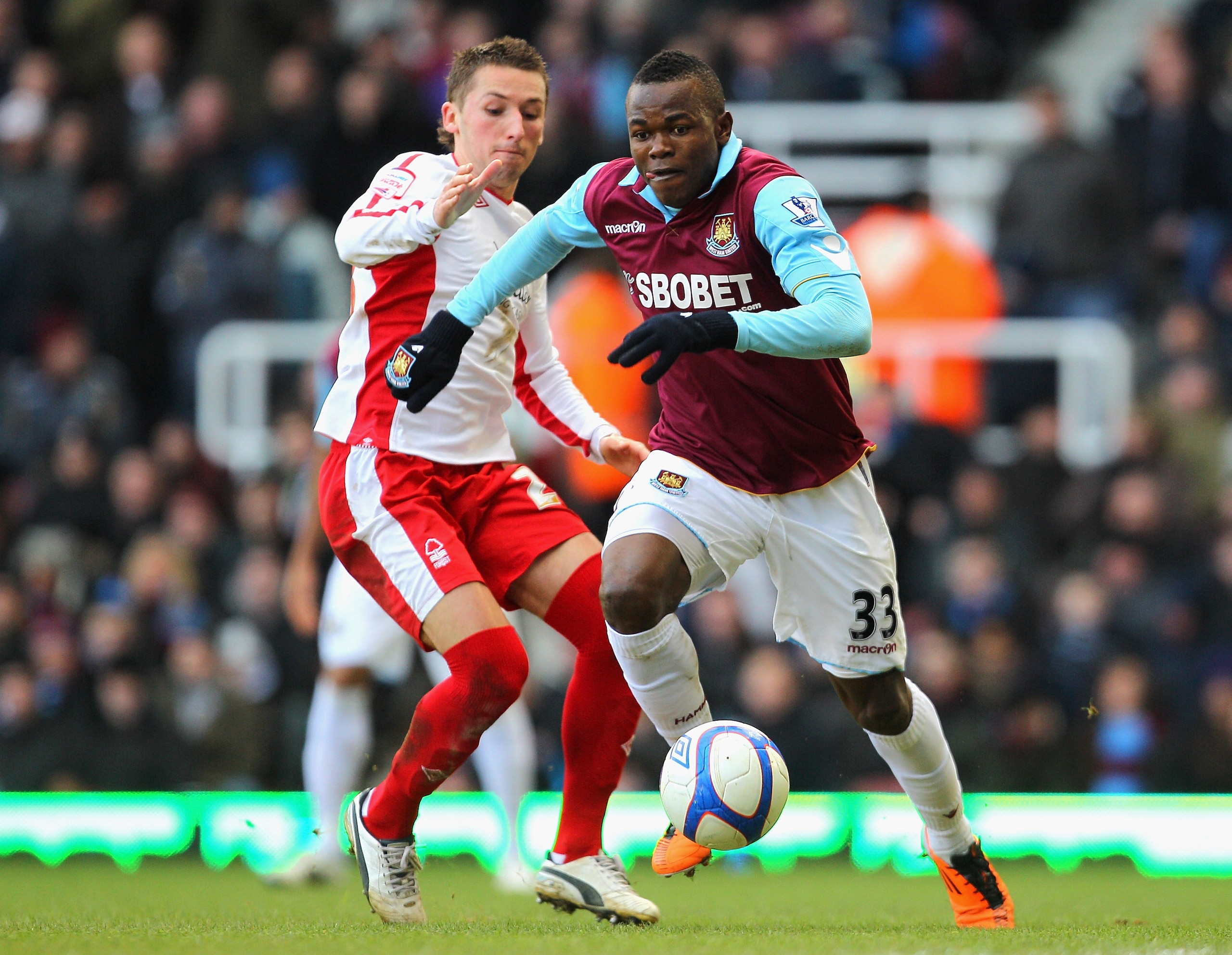 LONDON, ENGLAND - JANUARY 30:  Victor Obinna of West Ham United is challenged by Radoslaw Majewski of Nottingham Forest during the FA Cup sponsored by E.O.N 4th Round match between West Ham United and Nottingham Forest at the Boleyn Ground on January 30,