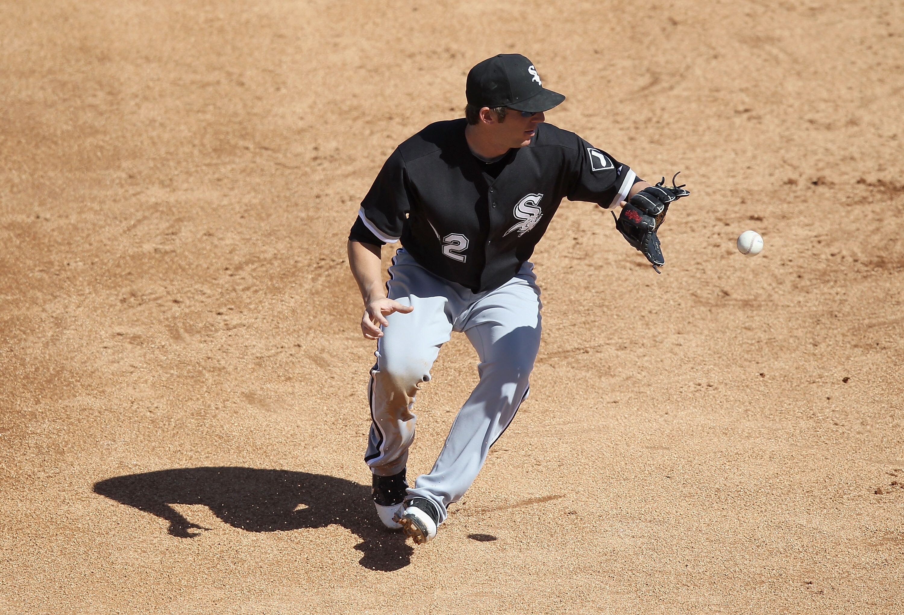 TUCSON, AZ - MARCH 07:  Infielder Brent Morel #22 of the Chicago White Sox fields a ground ball out against the Arizona Diamondbacks during the spring training game at Kino Veterans Memorial Stadium on March 7, 2011 in Tucson, Arizona. The charity game is