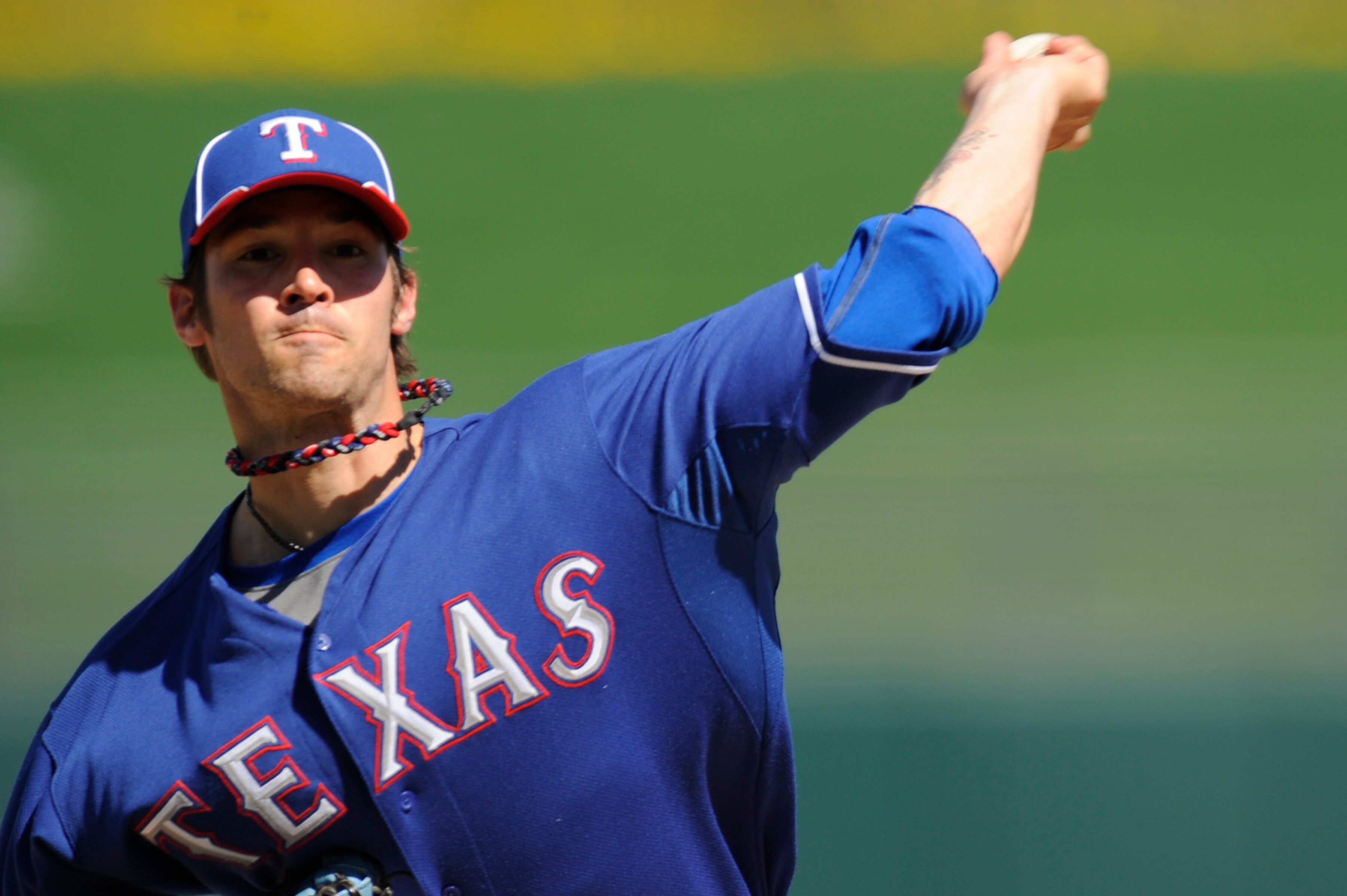 SURPISE, AZ - FEBRUARY 27: C.J. Wilson #36 of the Texas Rangers pitches during a spring training game against the Kansas City Royals at Surprise Stadium on February 27, 2011 in Surprise, Arizona. (Photo by Rob Tringali/Getty Images)