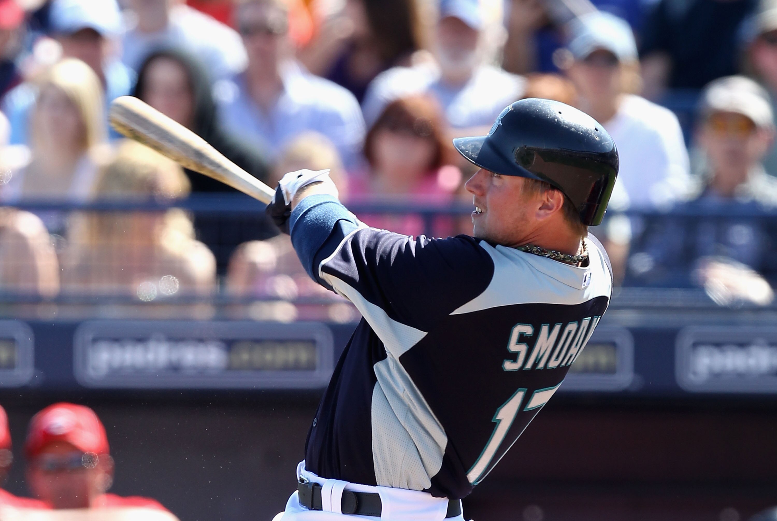PEORIA, AZ - MARCH 04:  Justin Smoak #17 of the Seattle Mariners his a single against the Cincinnati Reds during the second inning of the spring training game at Peoria Stadium on March 4, 2011 in Peoria, Arizona.  (Photo by Christian Petersen/Getty Image