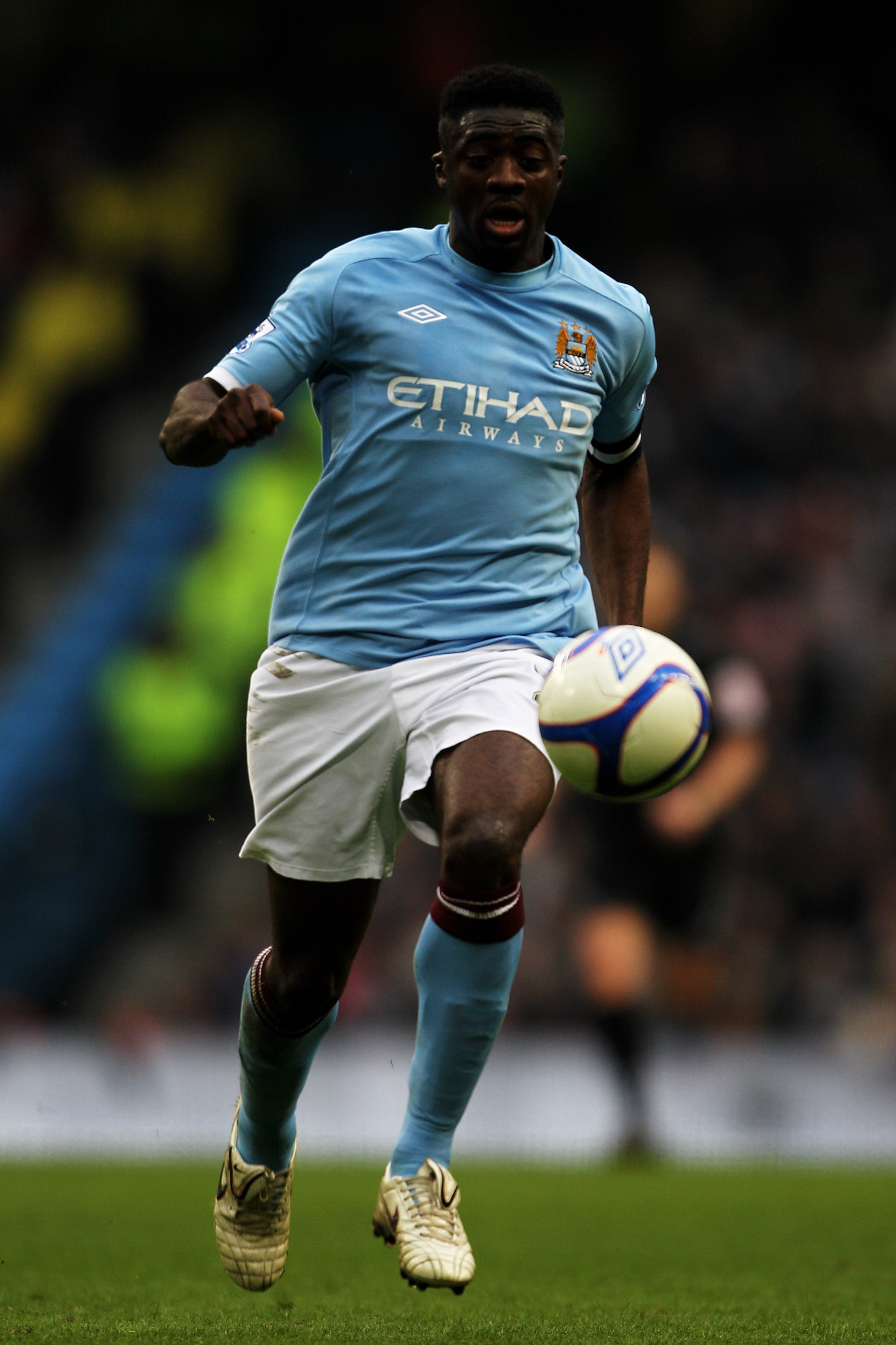 MANCHESTER, ENGLAND - FEBRUARY 20:  Kolo Toure of Manchester City on the ball during the FA Cup sponsored by E.On 4th Round replay match between Manchester City and Notts County at City of Manchester Stadium on February 20, 2011 in Manchester, England.  (