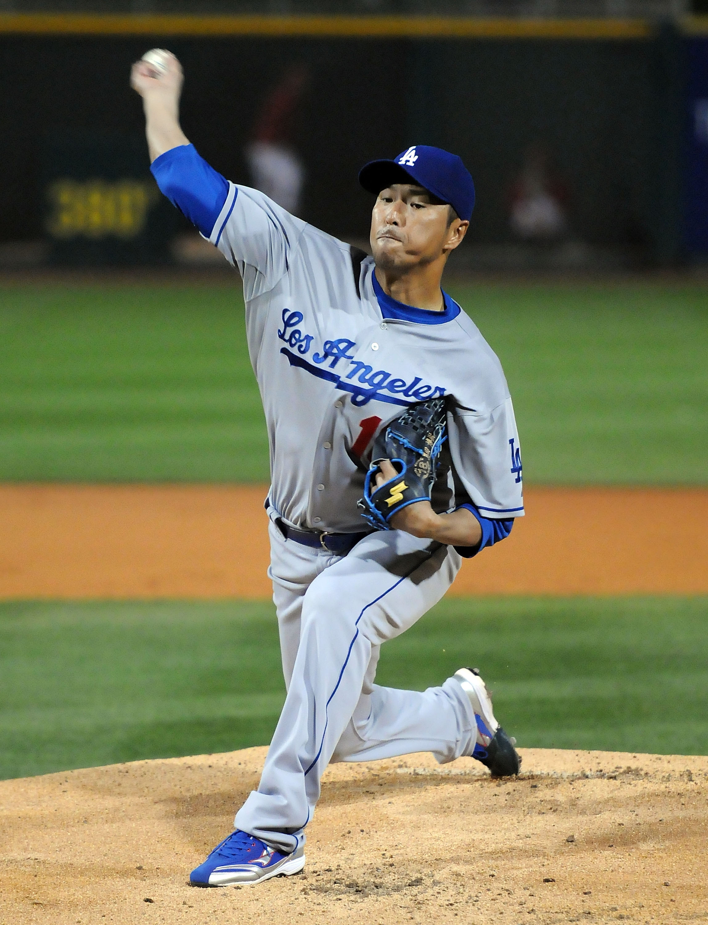 GOODYEAR, AZ - MARCH 03:  Hiroki Kuroda #18 of the Los Angeles Dodgers delivers a pitch against the Cincinnati Reds at Goodyear Ballpark on March 3, 2011 in Goodyear, Arizona.  (Photo by Norm Hall/Getty Images)