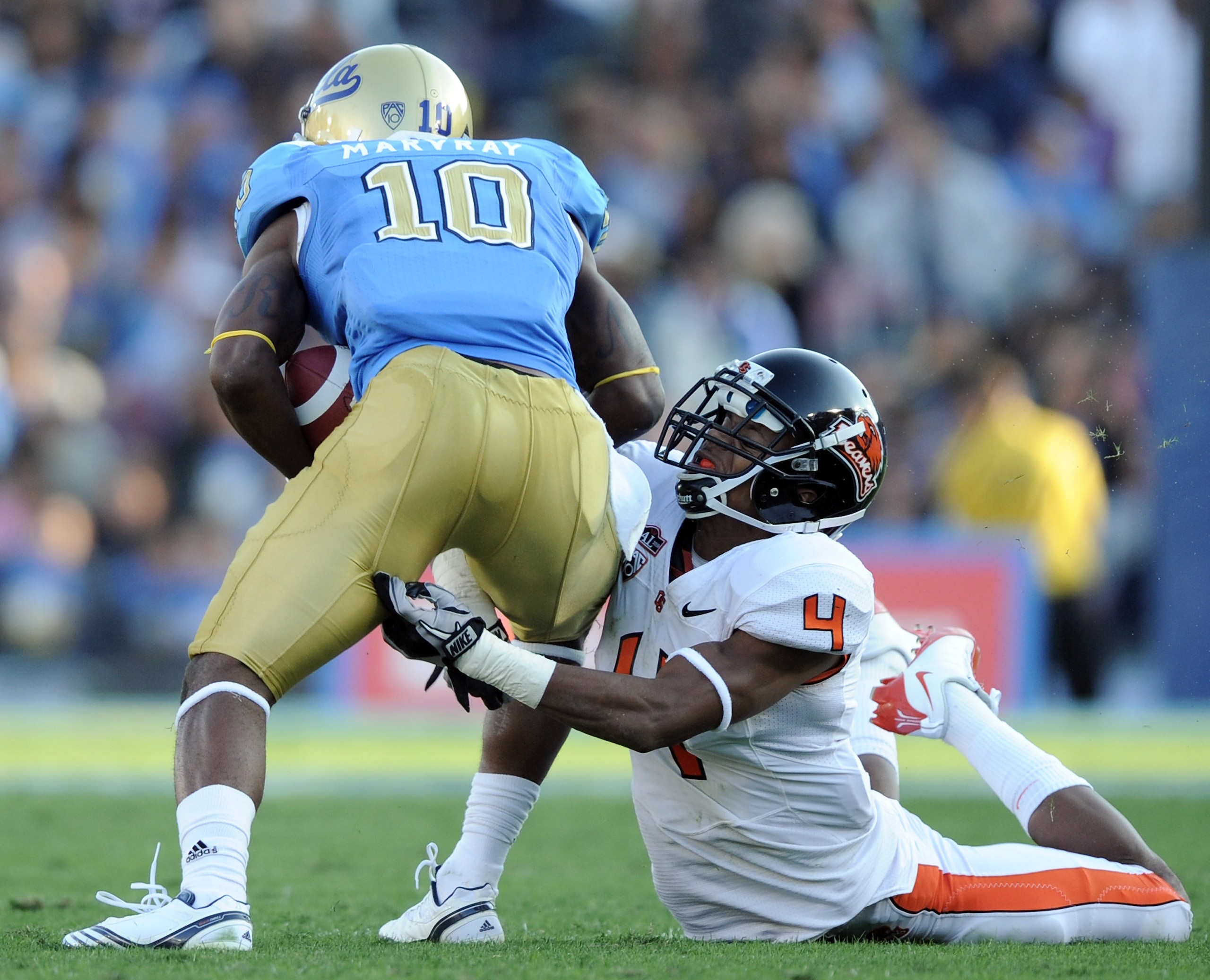 PASADENA, CA - NOVEMBER 06: James Dockery #4 of the Oregon State Beavers attempts to tackle Akeem Ayers #10 of the UCLA Bruins after a catch at the Rose Bowl on November 6, 2010 in Pasadena, California. (Photo by Harry How/Getty Images) PASADENA, CA - NOVEMBER 06: James Dockery #4 of the Oregon State Beavers attempts to tackle Akeem Ayers #10 of the UCLA Bruins after a catch at the Rose Bowl on November 6, 2010 in Pasadena, California. (Photo by Harry How/Getty Images)