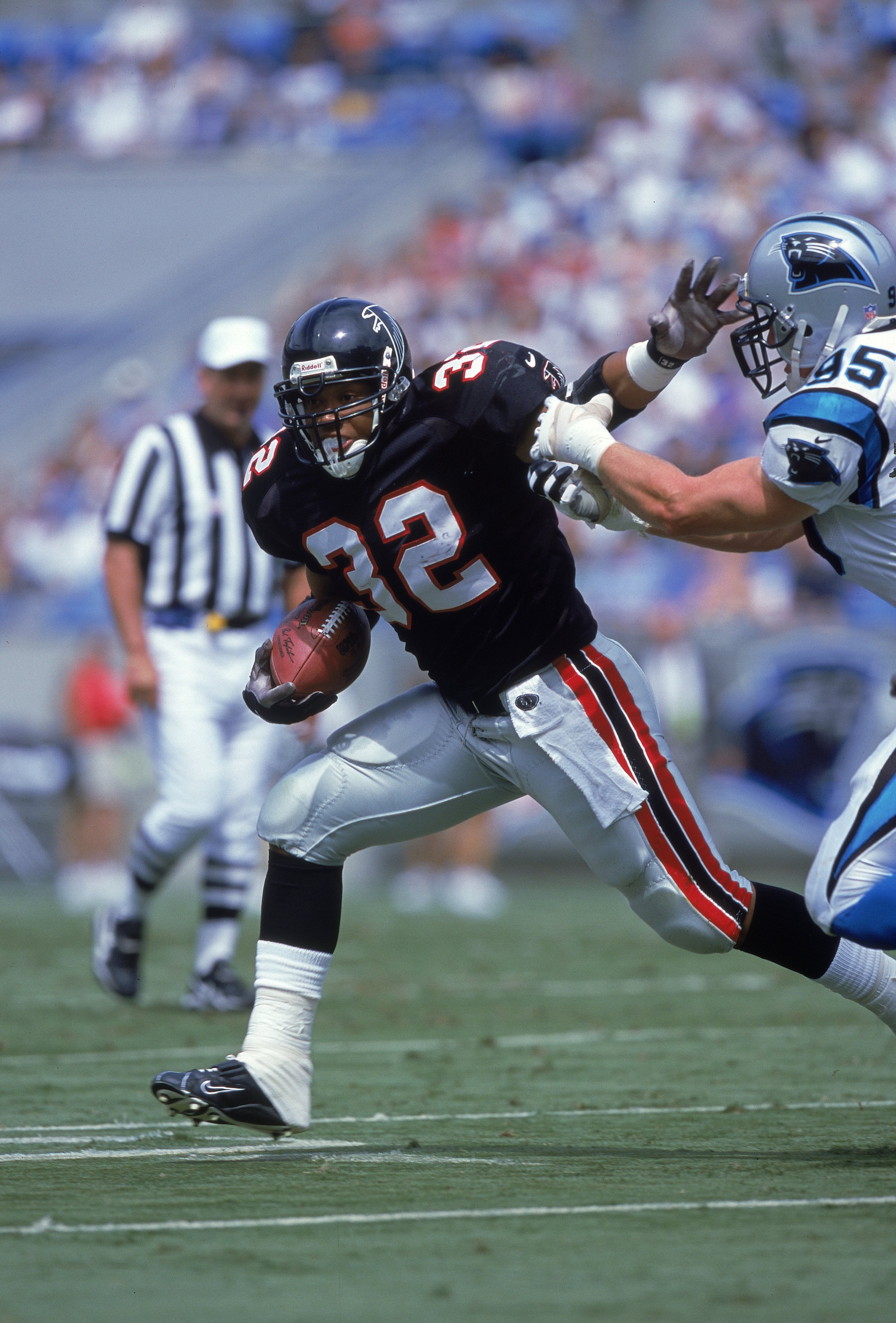 17 Sep 2000:  Jamal Anderson #32 of the Atlanta Falcons avoids getting tackled during the game against the Carolina Panthers at Ercsson Stadium in Charlotte, North Carolina.  The Packers defeated the Eagles 6-3.Mandatory Credit: Craig Jones  /Allsport
