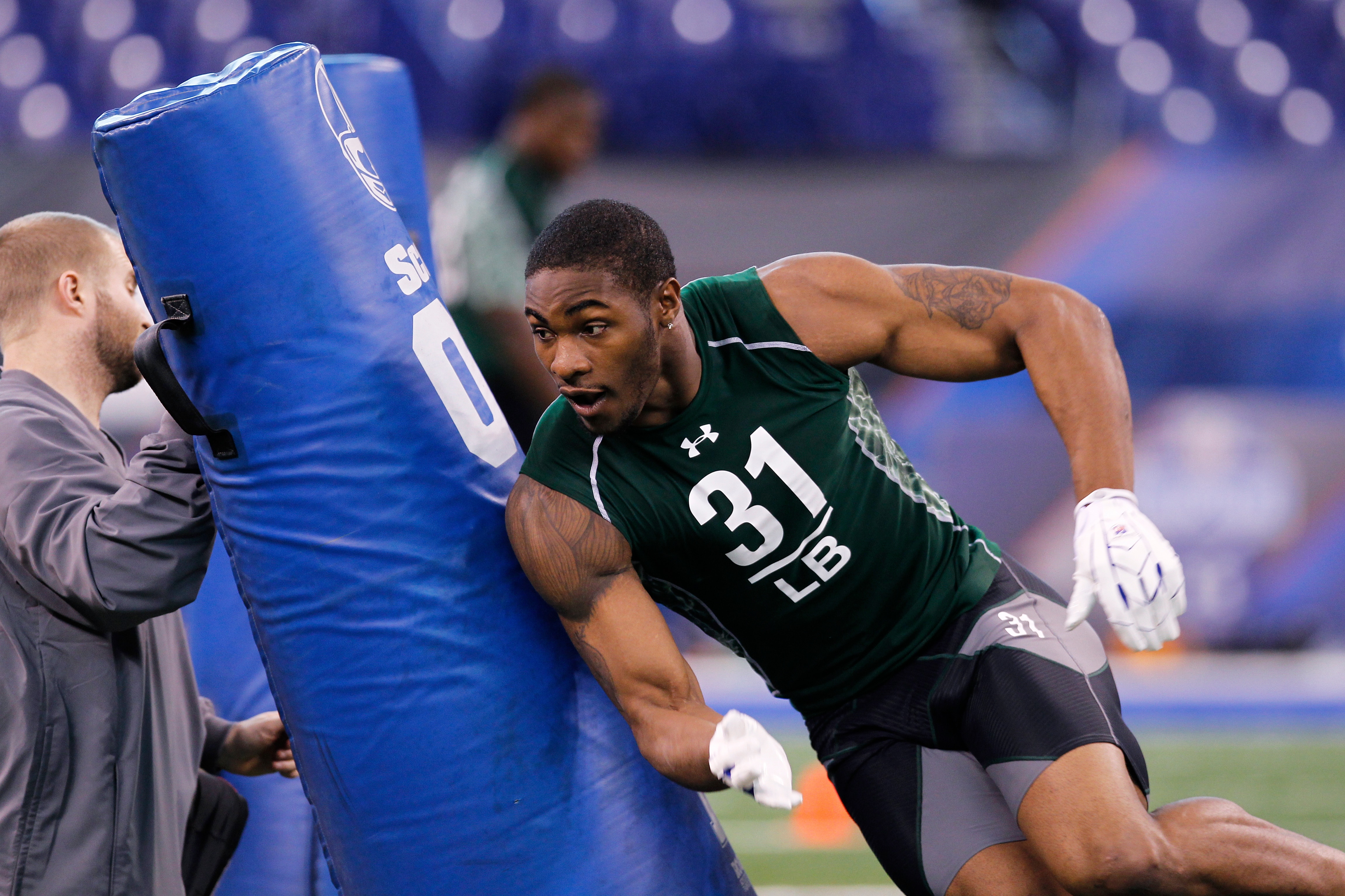INDIANAPOLIS, IN - FEBRUARY 28: Martez Wilson of Illinois works out during the 2011 NFL Scouting Combine at Lucas Oil Stadium on February 28, 2011 in Indianapolis, Indiana. (Photo by Joe Robbins/Getty Images)