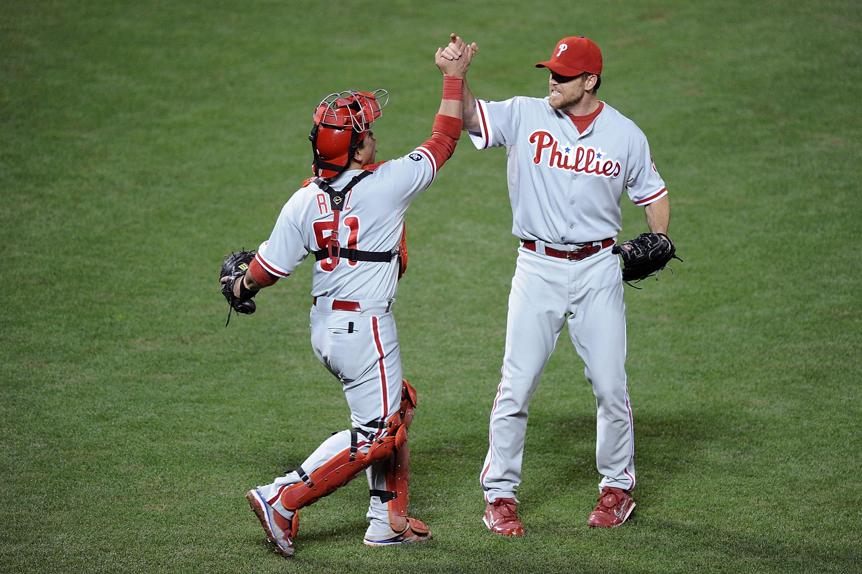 SAN FRANCISCO - OCTOBER 21:  Brad Lidge #54 and Carlos Ruiz #51 of the Philadelphia Phillies celebrate after defeating the San Francisco Giants 4-2 in Game Five of the NLCS during the 2010 MLB Playoffs at AT&T Park on October 21, 2010 in San Francisco, Ca