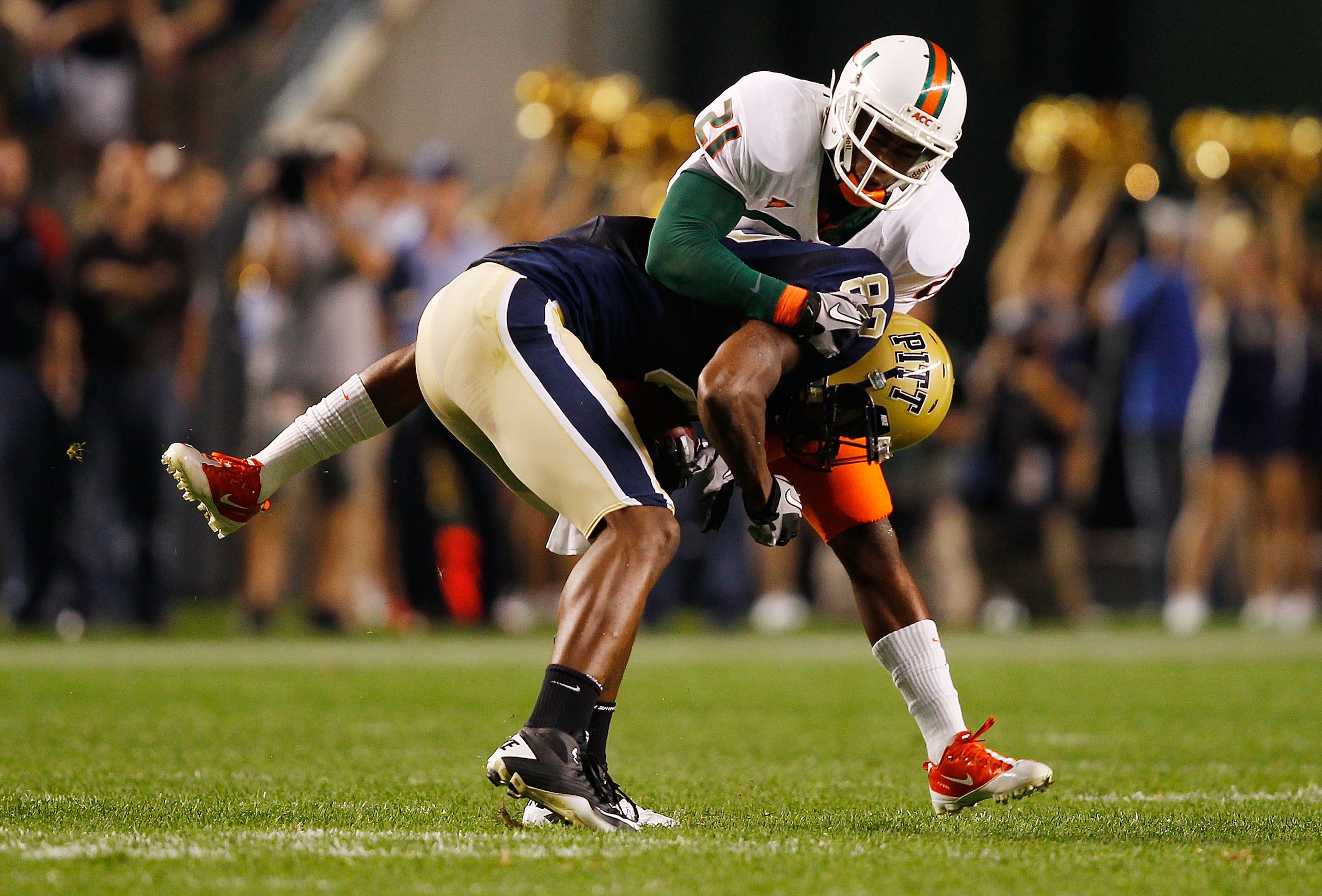PITTSBURGH - SEPTEMBER 23: Jon Baldwin #82 of the Pittsburgh Panthers is tackled by Brandon McGee #21 of the Miami Hurricanes on September 23, 2010 at Heinz Field in Pittsburgh, Pennsylvania. (Photo by Jared Wickerham/Getty Images) PITTSBURGH - SEPTEMBER 23: Jon Baldwin #82 of the Pittsburgh Panthers is tackled by Brandon McGee #21 of the Miami Hurricanes on September 23, 2010 at Heinz Field in Pittsburgh, Pennsylvania. (Photo by Jared Wickerham/Getty Images)