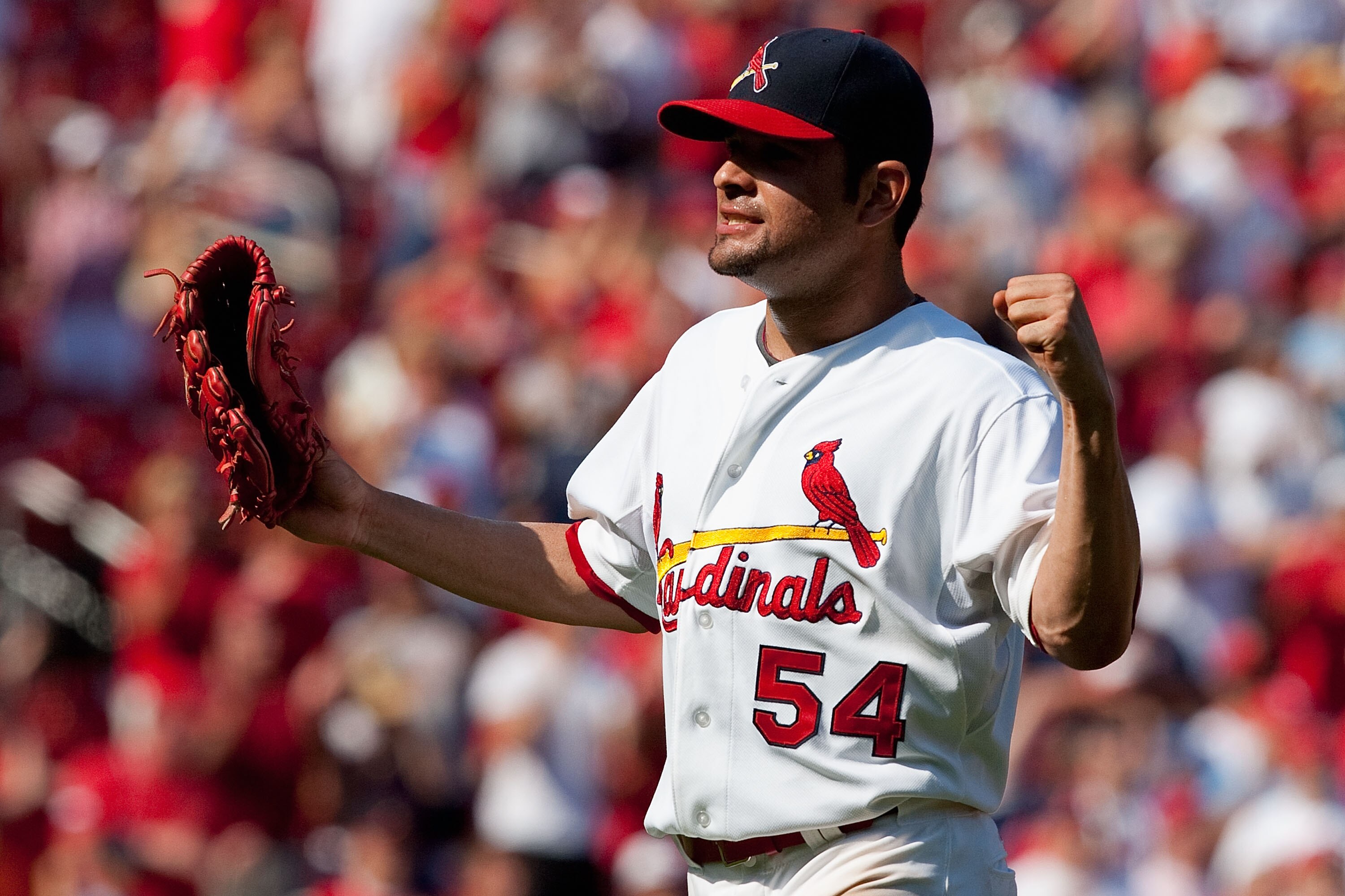 ST. LOUIS - AUGUST 22: Starter Jaime Garcia  #54 of the St. Louis Cardinals celebrates his three-hit game against the San Francisco Giants at Busch Stadium on August 22, 2010 in St. Louis, Missouri.  (Photo by Dilip Vishwanat/Getty Images)