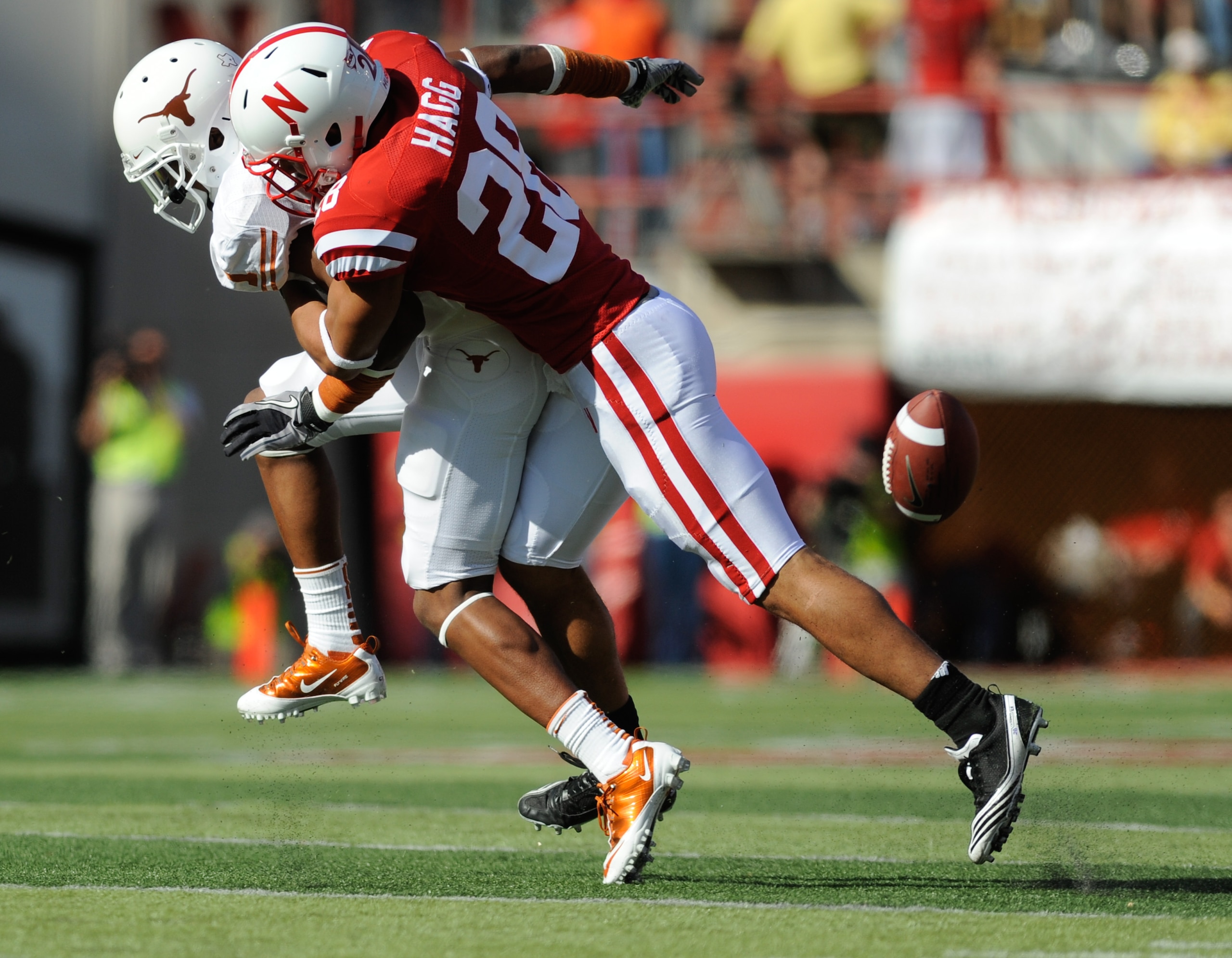 LINCOLN, NE - OCTOBER 16: Wide receiver Mike Davis #1 of the Texas Longhorns gets the ball knocked away by defensive back Eric Hagg #28 of the Nebraska Cornhuskers during first half action of their game at Memorial Stadium on October 16, 2010 in Lincoln, LINCOLN, NE - OCTOBER 16: Wide receiver Mike Davis #1 of the Texas Longhorns gets the ball knocked away by defensive back Eric Hagg #28 of the Nebraska Cornhuskers during first half action of their game at Memorial Stadium on October 16, 2010 in Lincoln,