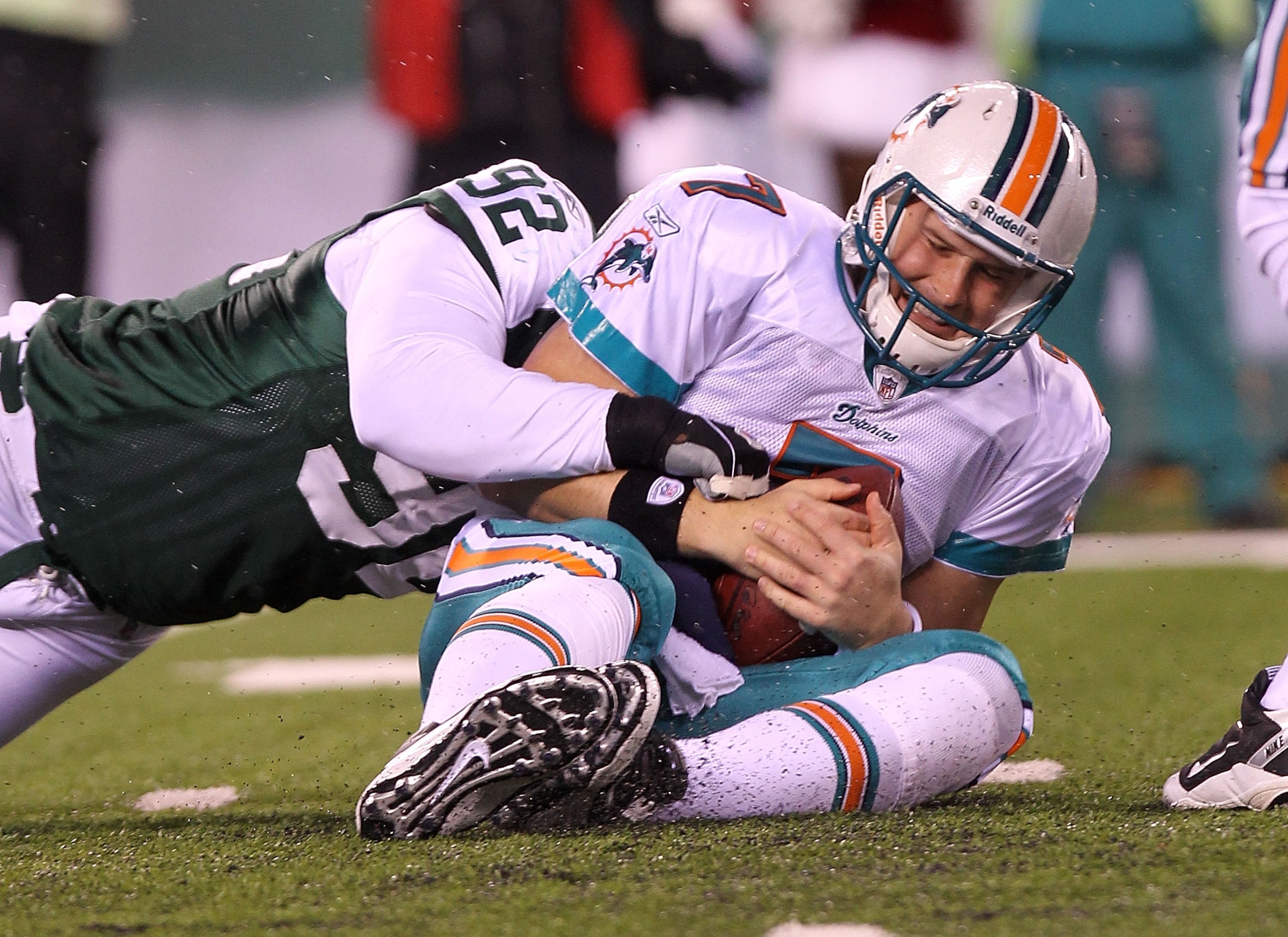 EAST RUTHERFORD, NJ - DECEMBER 12:  Chad Henne #7 of the Miami Dolphins is sacked by Shaun Ellis #92 of the New York Jets at New Meadowlands Stadium on December 12, 2010 in East Rutherford, New Jersey.  (Photo by Nick Laham/Getty Images)