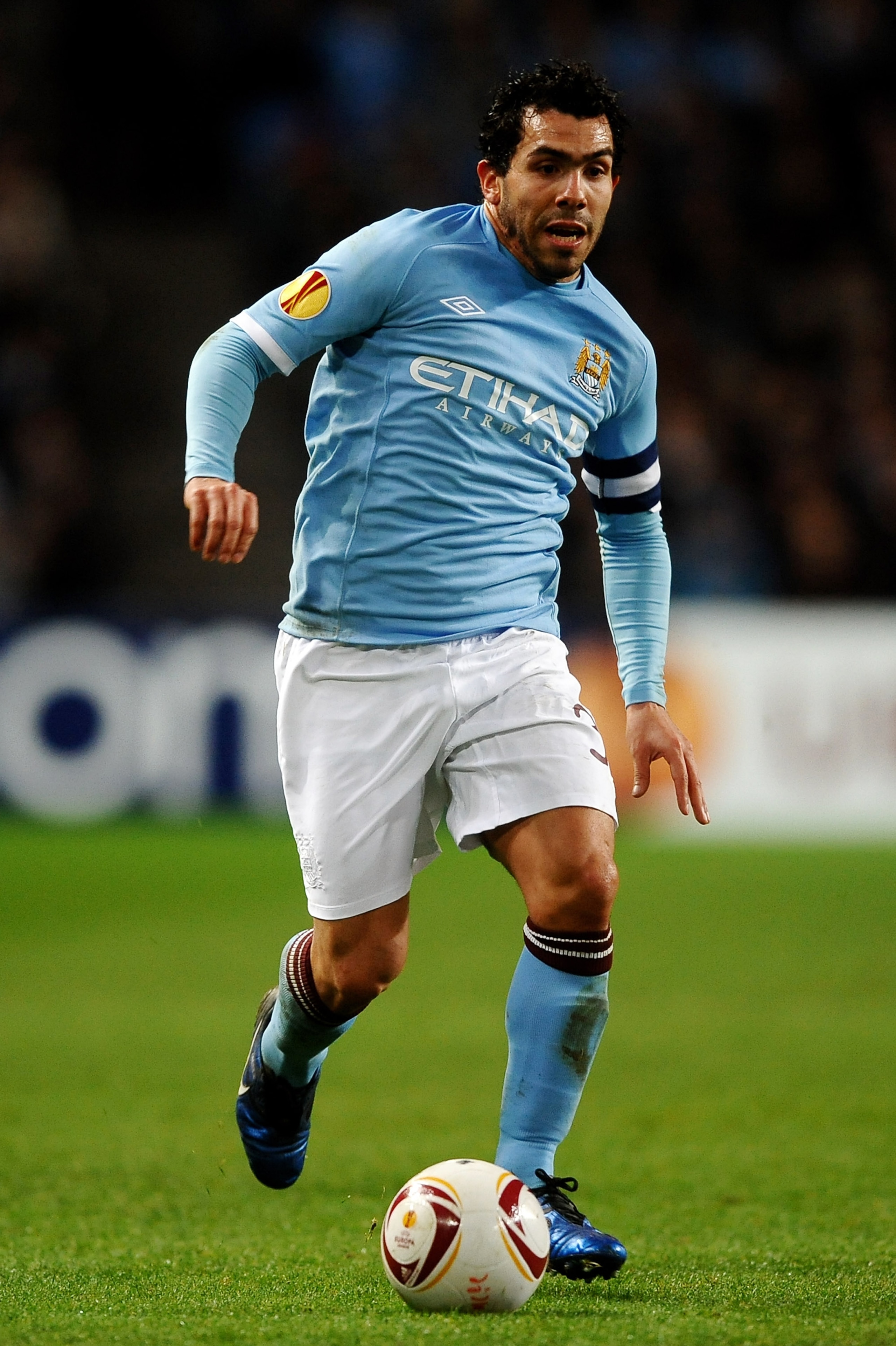 MANCHESTER, ENGLAND - MARCH 17:  Carlos Tevez of Manchester City runs with the ball during the UEFA Europa League round of 16 second leg match between Manchester City and Dynamo Kiev at City of Manchester Stadium on March 17, 2011 in Manchester, England.