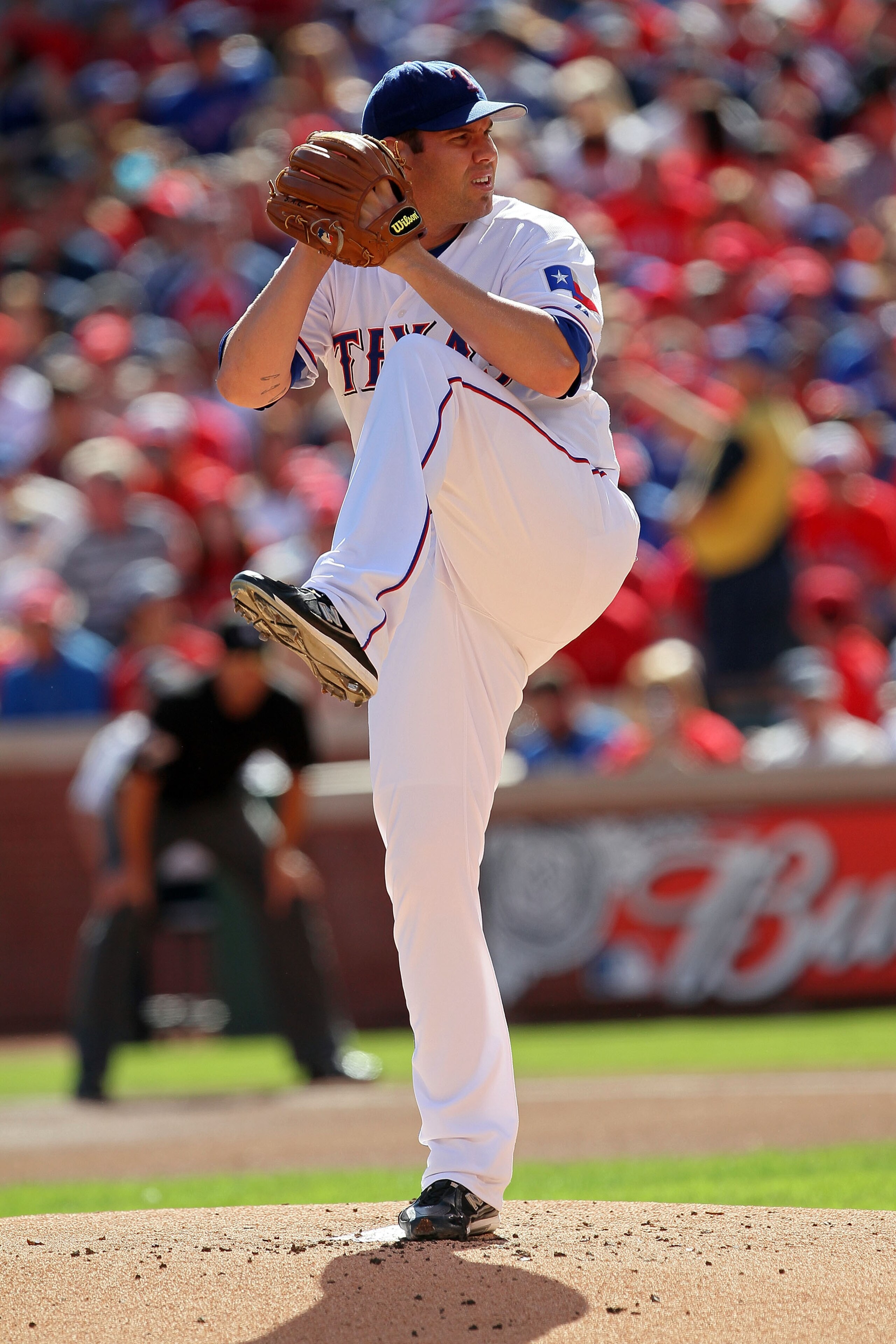 ARLINGTON, TX - OCTOBER 16:  Starting pitcher Colby Lewis #48 of the Texas Rangers throws a pitch against the New York Yankees in Game Two of the ALCS during the 2010 MLB Playoffs at Rangers Ballpark in Arlington on October 16, 2010 in Arlington, Texas.