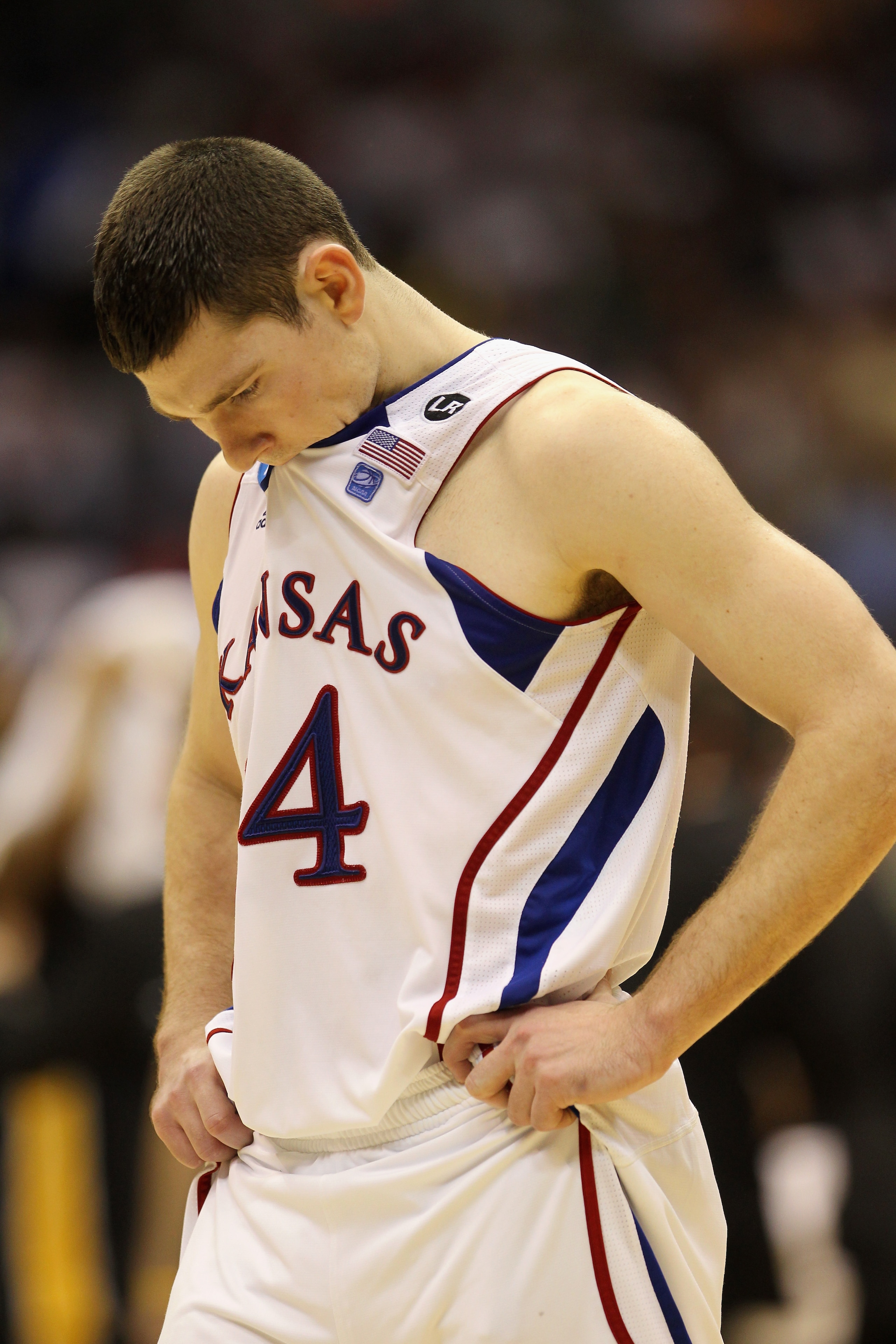 SAN ANTONIO, TX - MARCH 27:  Tyrel Reed #14 of the Kansas Jayhawks reacts after the southwest regional final of the 2011 NCAA men's basketball tournament against the Virginia Commonwealth Rams at the Alamodome on March 27, 2011 in San Antonio, Texas.  (Ph