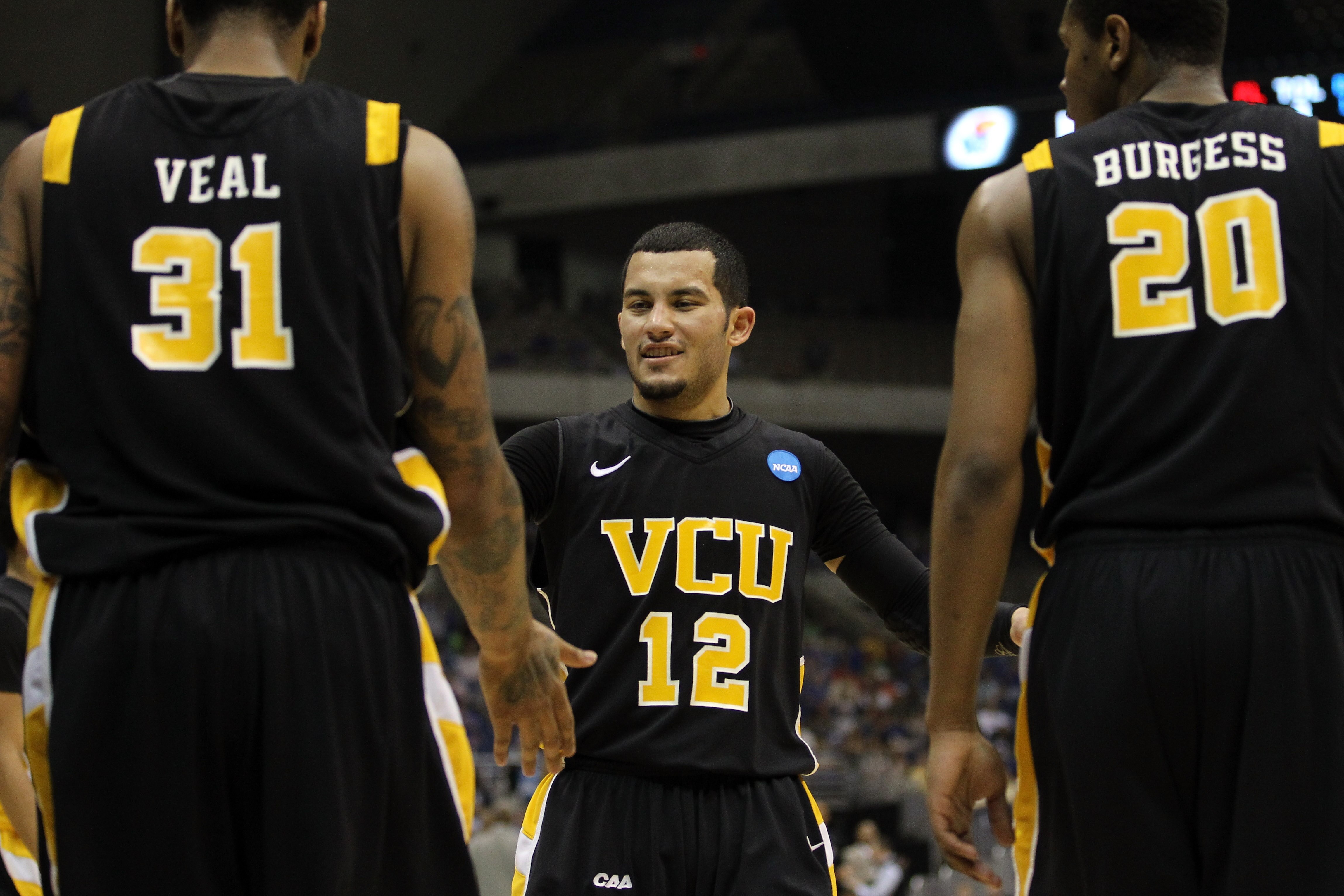 SAN ANTONIO, TX - MARCH 27:  (L-R) Toby Veal #31, Joey Rodriguez #12 and Bradford Burgess #20 of the Virginia Commonwealth Rams react during the southwest regional final of the 2011 NCAA men's basketball tournament against the Kansas Jayhawks at the Alamo