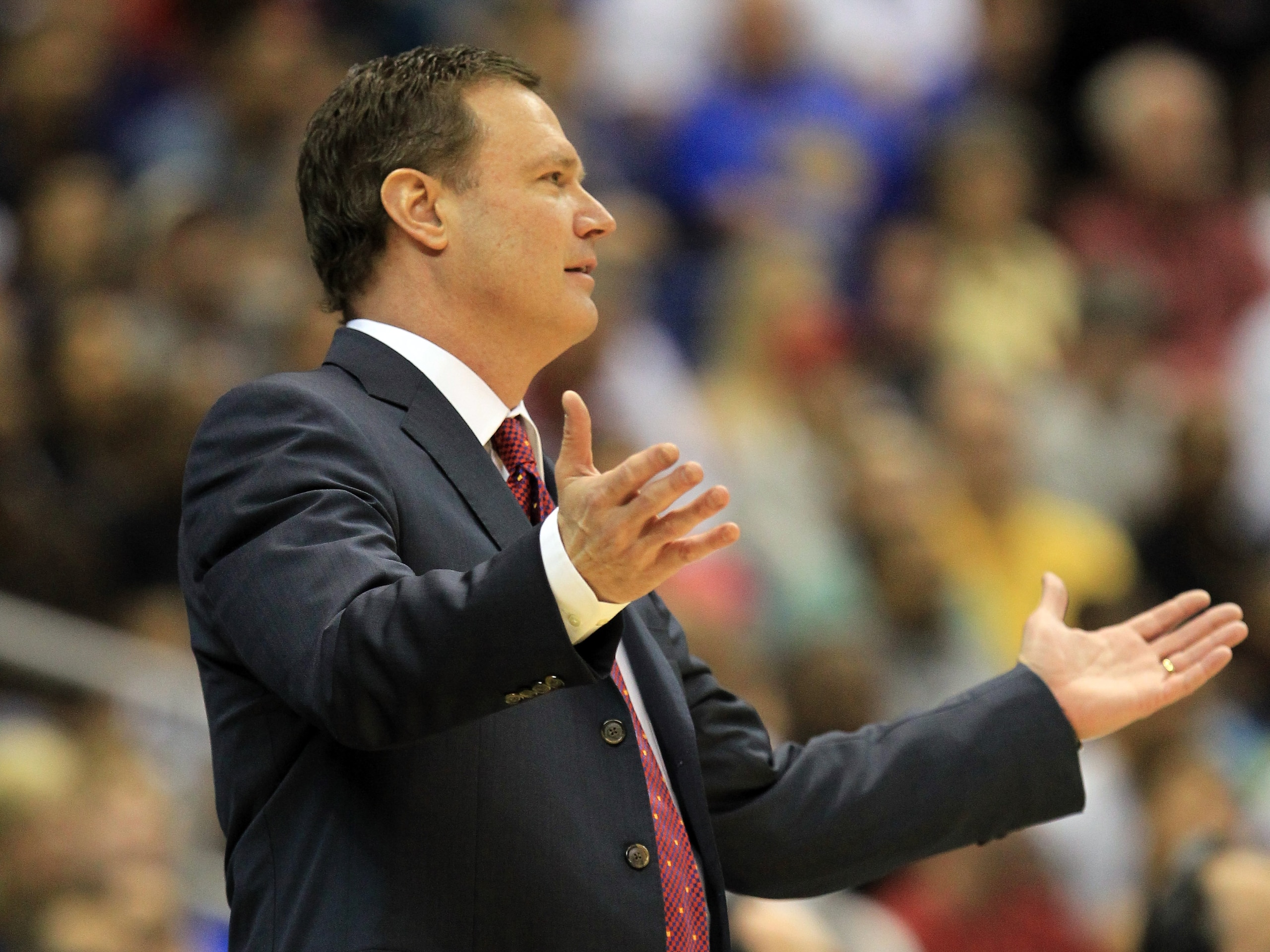 SAN ANTONIO, TX - MARCH 27:  Head coach Bill Self of the Kansas Jayhawks reacts during the southwest regional final of the 2011 NCAA men's basketball tournament against the Virginia Commonwealth Rams at the Alamodome on March 27, 2011 in San Antonio, Texa