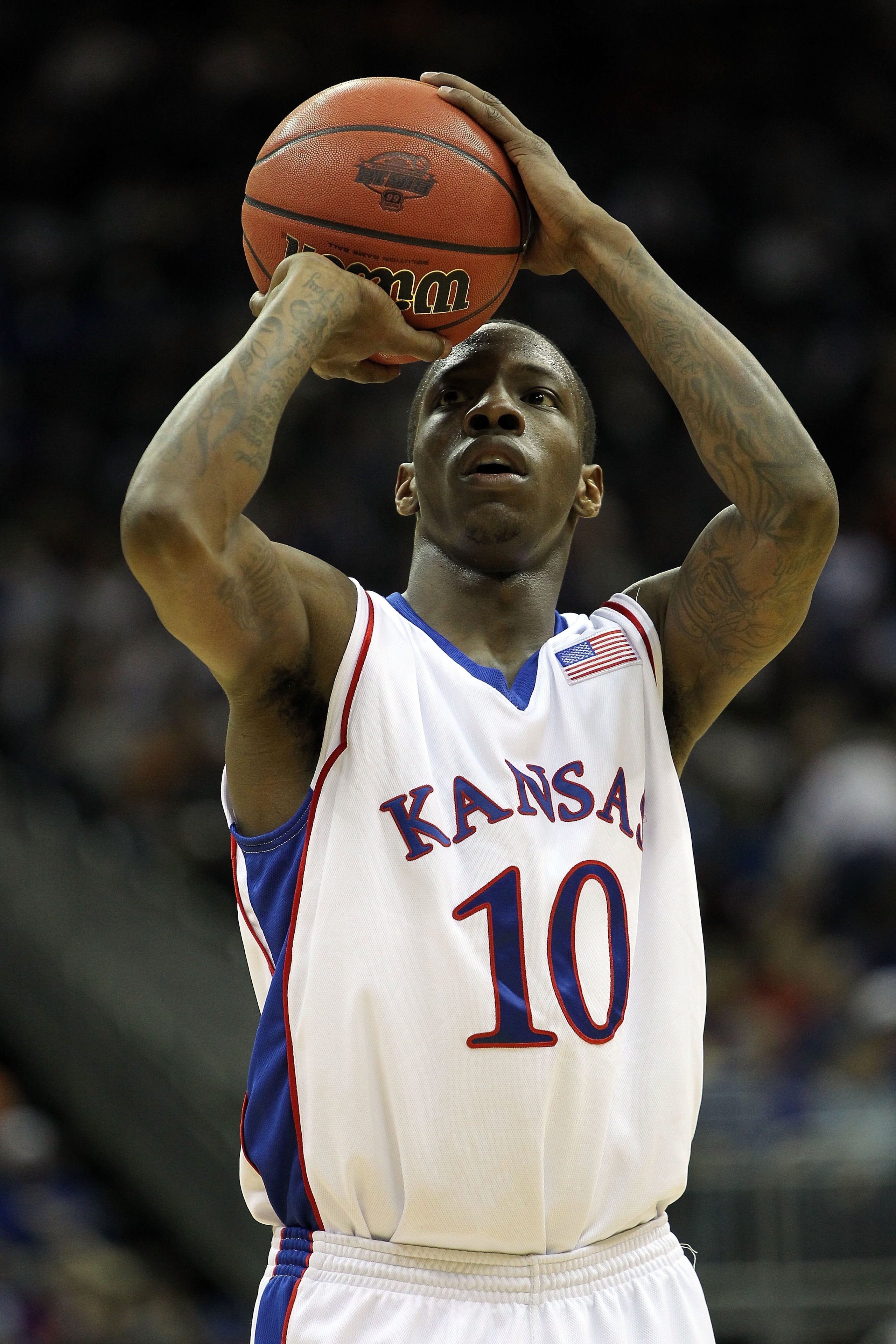 KANSAS CITY, MO - MARCH 11:  Tyshawn Taylor #10 of the Kansas Jayhawks shoots a free throw against the Texas Tech Red Raiders during the quarterfinals of the 2010 Phillips 66 Big 12 Men's Basketball Tournament at the Sprint Center on March 11, 2010 in Kan