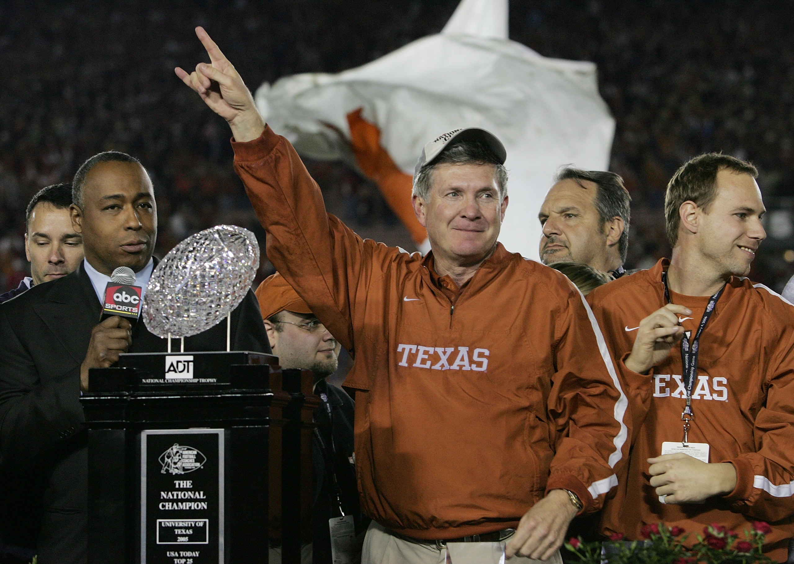 PASADENA, CA - JANUARY 04:  Head coach Mack Brown of the Texas Longhorns celebrates with the National Championship trophy after defeating the USC Trojans 41-38 to win the BCS National Championship Rose Bowl Game on January 4, 2006 in Pasadena, California.