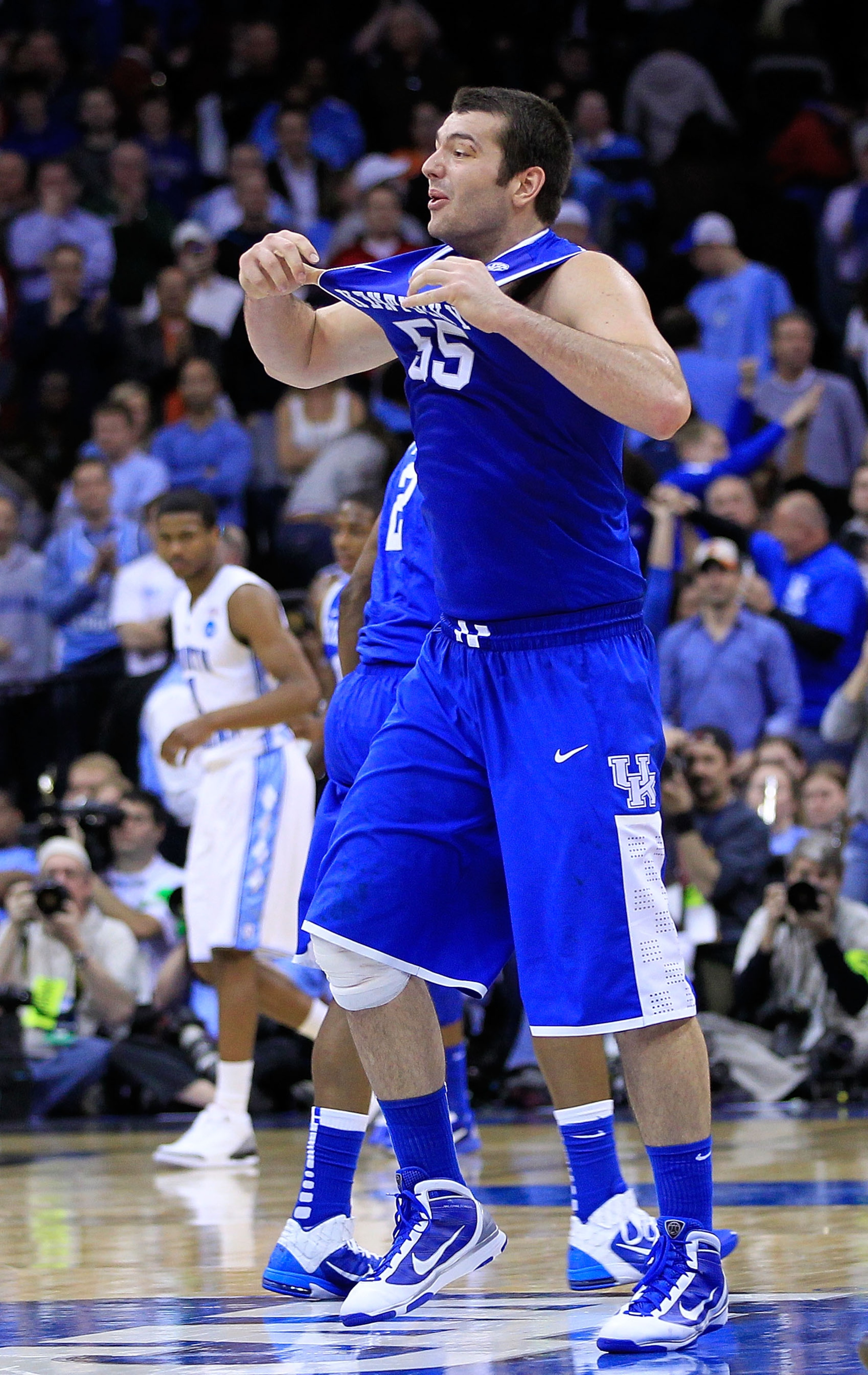 NEWARK, NJ - MARCH 27:  Josh Harrellson #55 of the Kentucky Wildcats celebrates defeating the North Carolina Tar Heels in the east regional final of the 2011 NCAA men's basketball tournament at Prudential Center on March 27, 2011 in Newark, New Jersey.  (