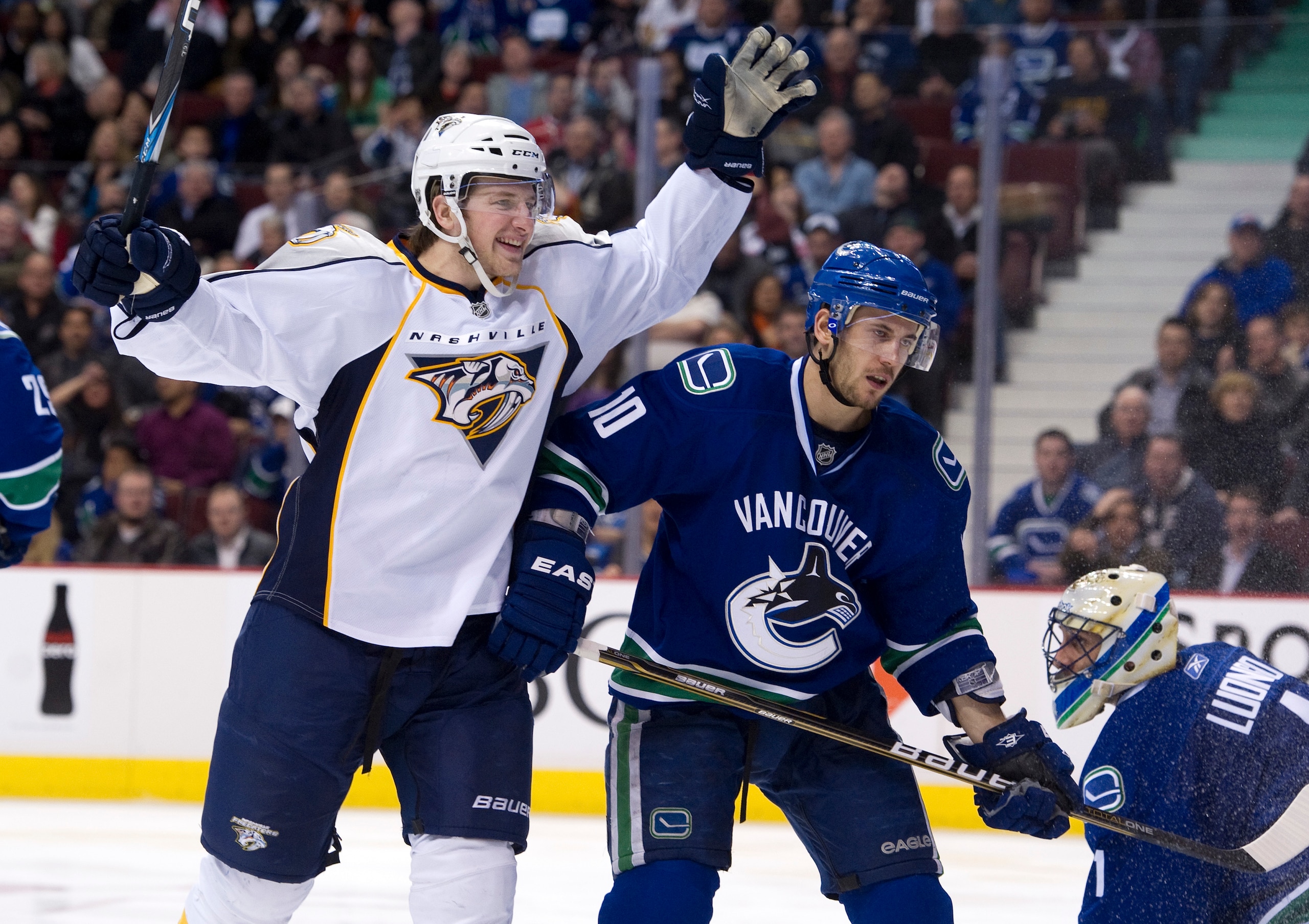 VANCOUVER, CANADA - MARCH 3: Blake Geoffrion #5 of the Nashville Predators celebrates after scoring what proved to be the game winning goal against goalie Roberto Luongo #1 of the Vancouver Canucks as Jeff Tambellini #10 skates past during the third perio