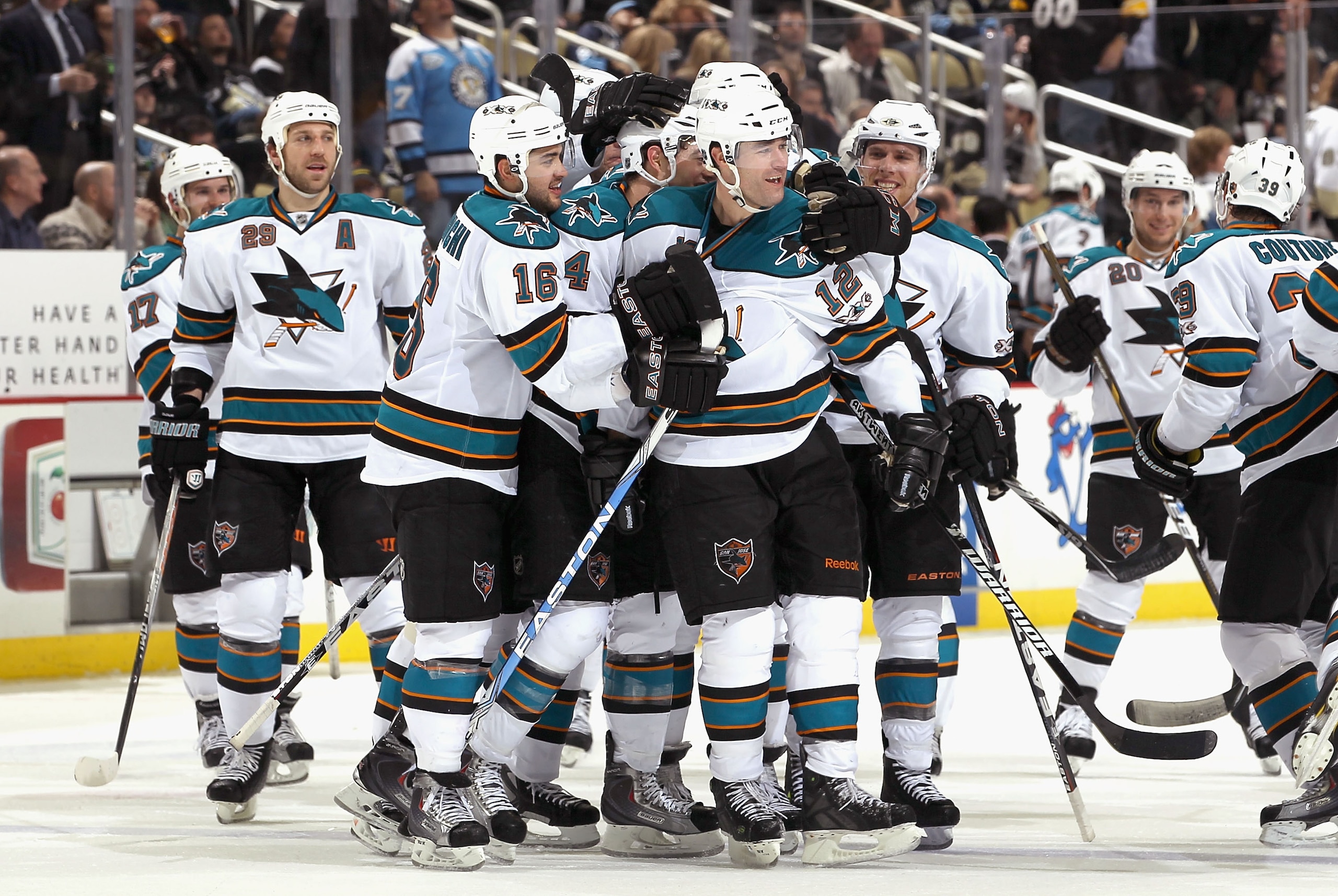 PITTSBURGH, PA - FEBRUARY 23:  Patrick Marleau #12 (C) of the San Jose Sharks celebrates with teammates Ryane Clowe #29, Devin Setoguchi #16, Marc-Edouard Vlasic #44 and Joe Pavelski #8 after Marleau scored the game winning goal against the Pittsburgh Pen