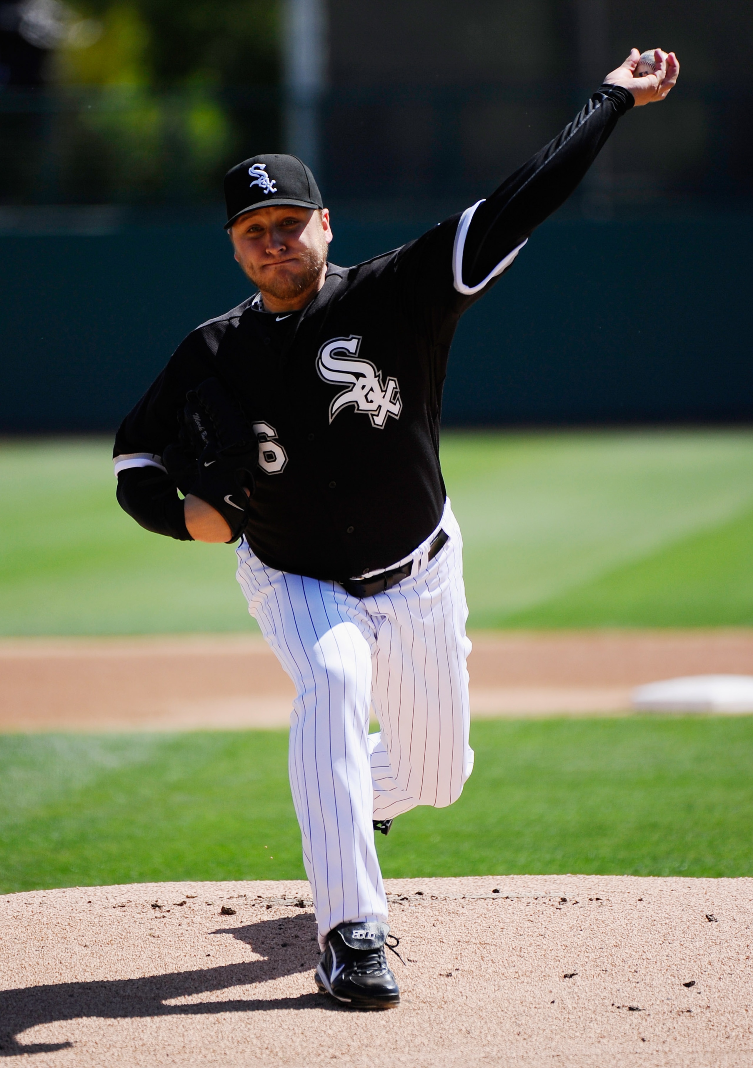 GLENDALE, AZ - MARCH 11:  Pitcher Mark Buehrle #56 of the Chicago White Sox throws a pitch prior to the start of the spring training baseball game against the Chicago Cubs at Camelback Ranch on March 11, 2011 in Glendale, Arizona.  (Photo by Kevork Djanse