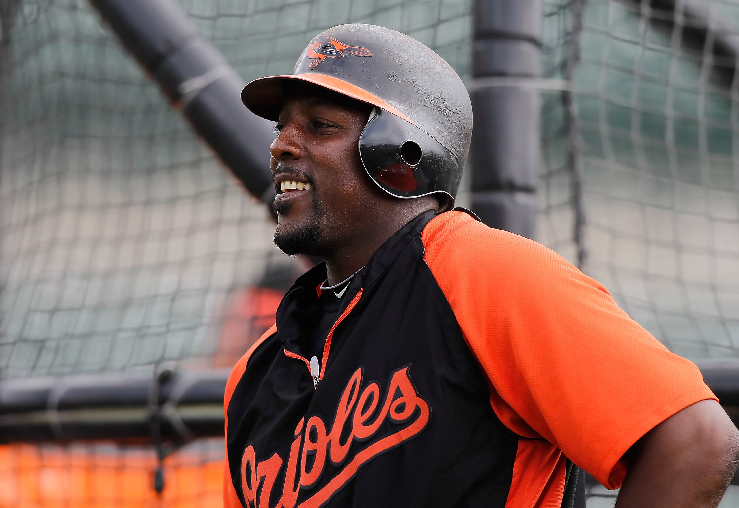 SARASOTA, FL - MARCH 05:  Designated hitter Vladimir Guerrero #27 of the Baltimore Orioles smiles during batting practice just before the start of the Grapefruit League Spring Training Game against the Boston Red Sox at Ed Smith Stadium on March 5, 2011 i