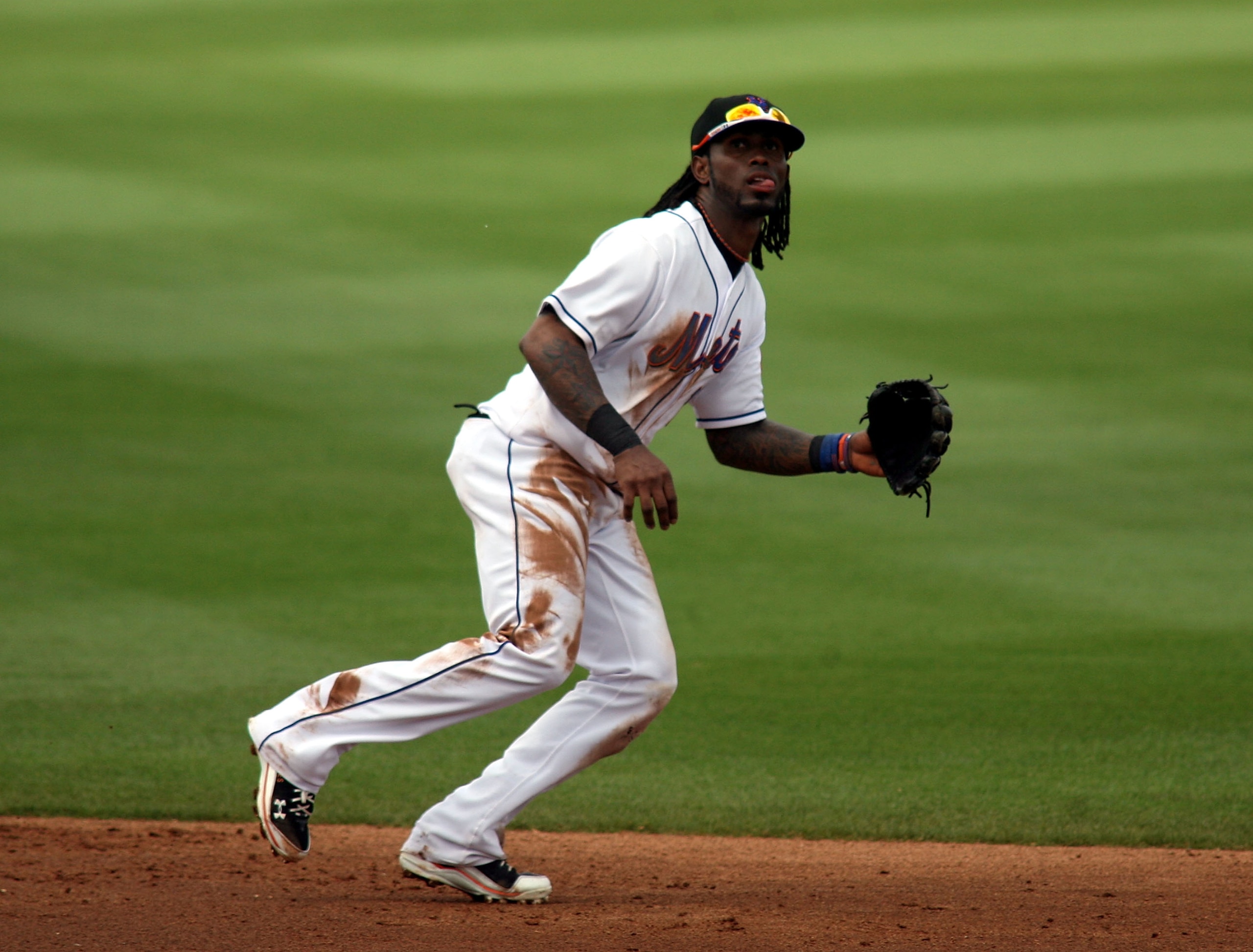PORT ST. LUCIE, FL - MARCH 03: Shortstop Jose Reyes #7 of the New York Mets plays the field against the St. Louis Cardinals stealing second base at Digital Domain Park on March 3, 2011 in Port St. Lucie, Florida.  (Photo by Marc Serota/Getty Images)