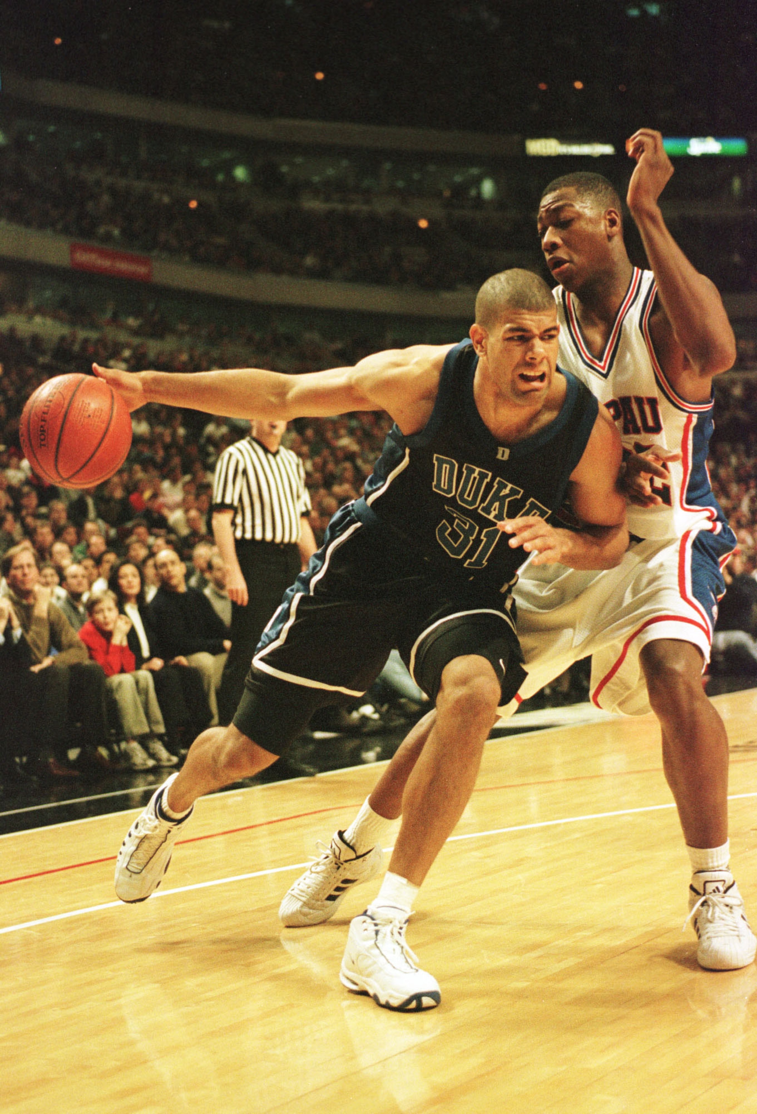 24 Feb 1999: Shane Battier #31 of Duke drives to the basket against Elton Brand #42 of DePaul during the first half at the United Center in Chicago, Illinois. Mandatory Credit: Matthew Stockman/ALLSPORT