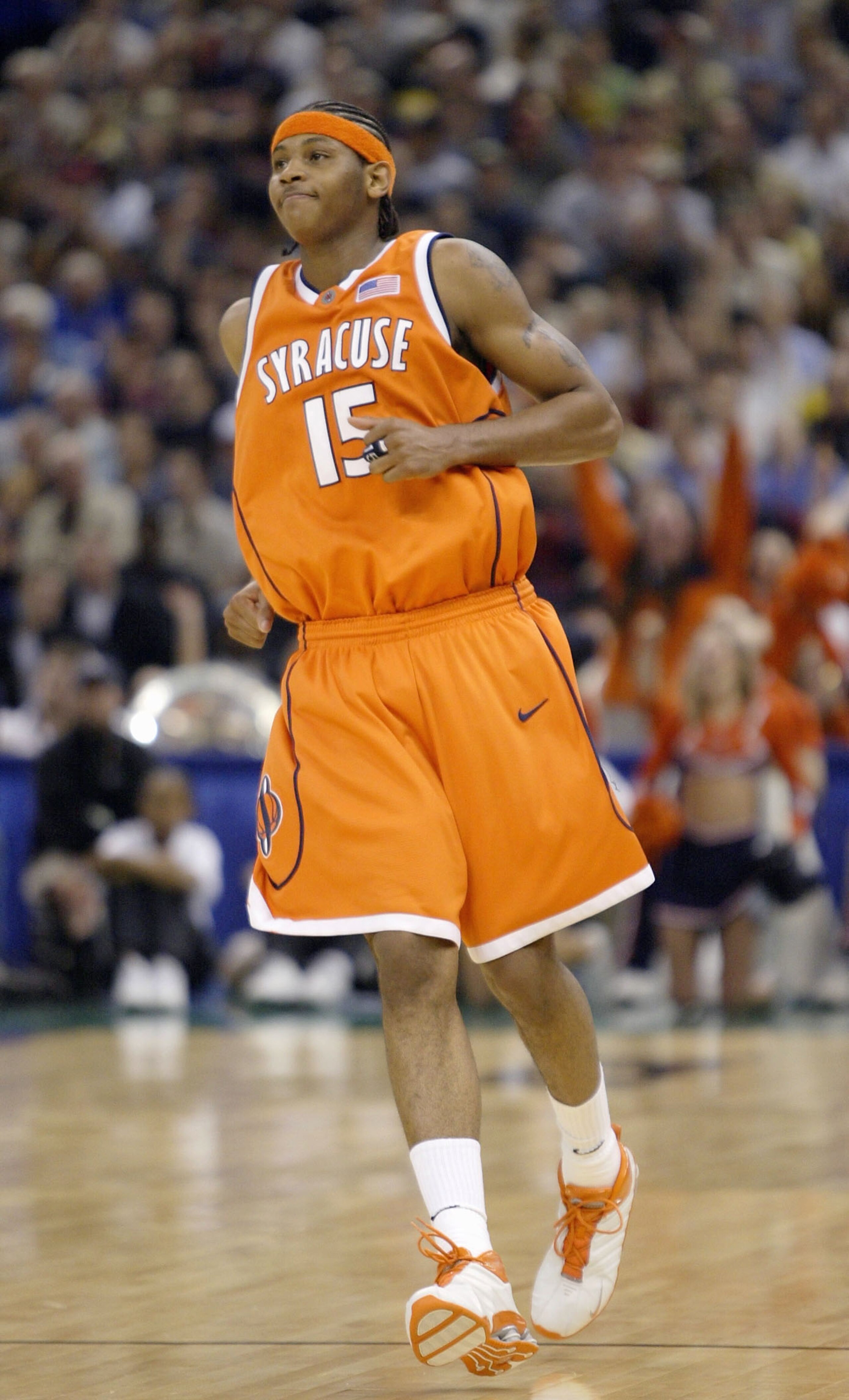 NEW ORLEANS - APRIL 7:  Carmelo Anthony #15 of Syracuse smiles after making a basket against the Kansas defense during the championship game of the NCAA Men's Final Four Tournament on April 7, 2003 at the Louisiana Superdome in New Orleans, Louisiana.  (P
