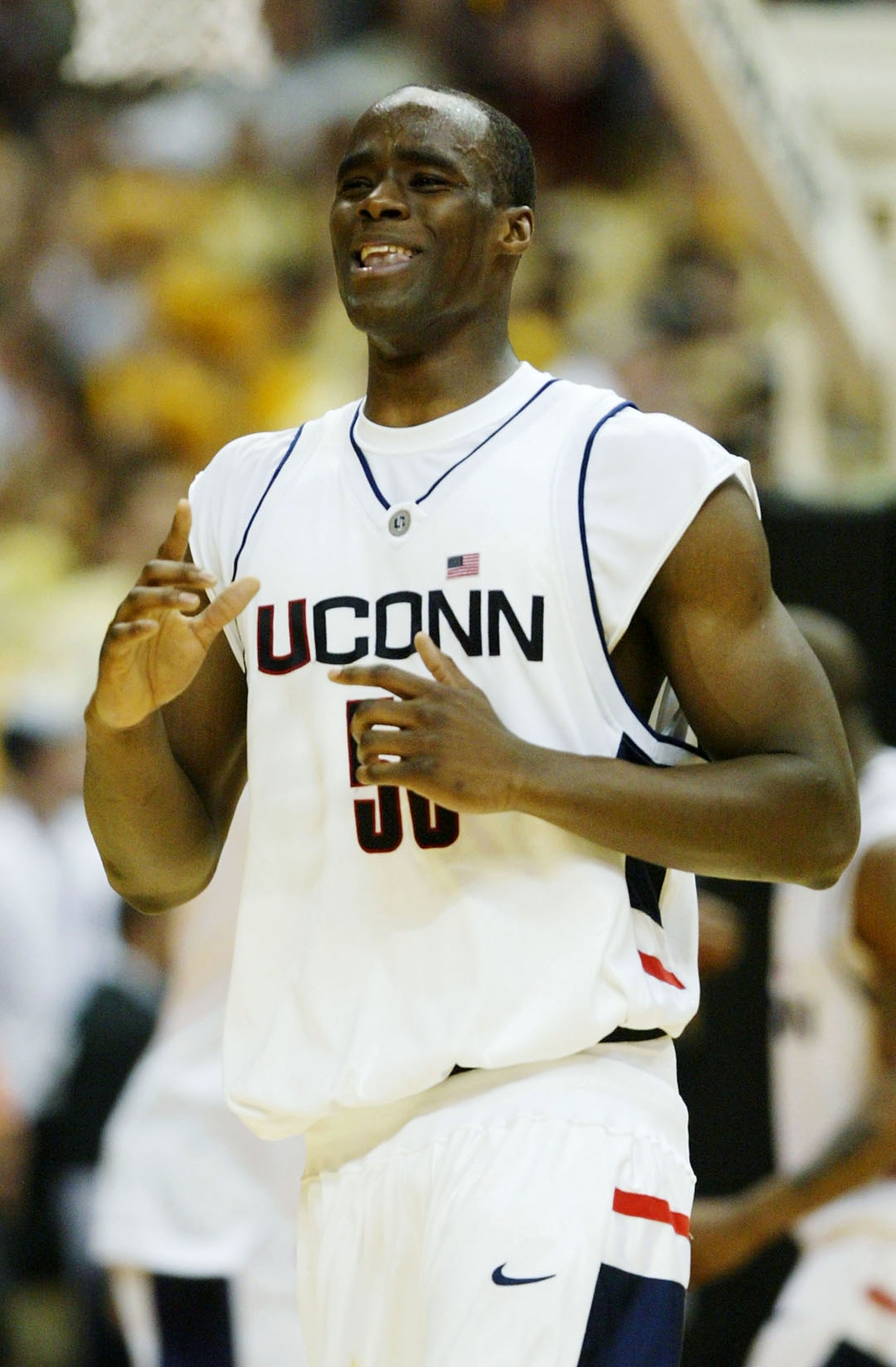 SAN ANTONIO - APRIL 5:  Emeka Okafor #50 of the UConn Huskies celebrates after defeating the Georgia Tech Yellow Jackets 82-73 during the National Championship game of the NCAA Men's Final Four Tournament at the Alamodome on April 5, 2004 in San Antonio,