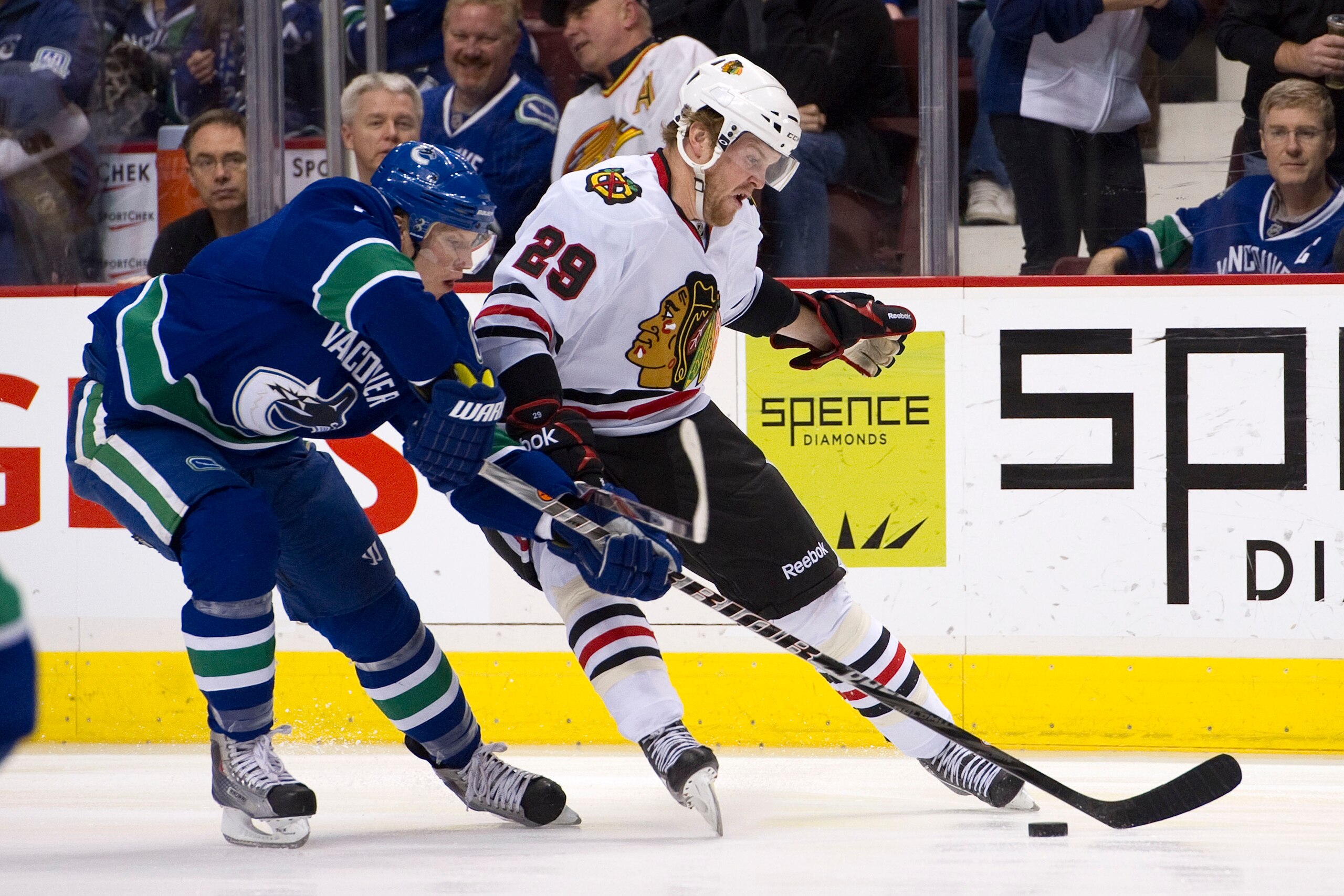 VANCOUVER, CANADA - FEBRUARY 4: Bryan Bickell #29 of the Chicago Blackhawks tries to get past Christian Ehrhoff #5 of the Vancouver Canucks during the first period in NHL action on February 04, 2011 at Rogers Arena in Vancouver, British Columbia, Canada.