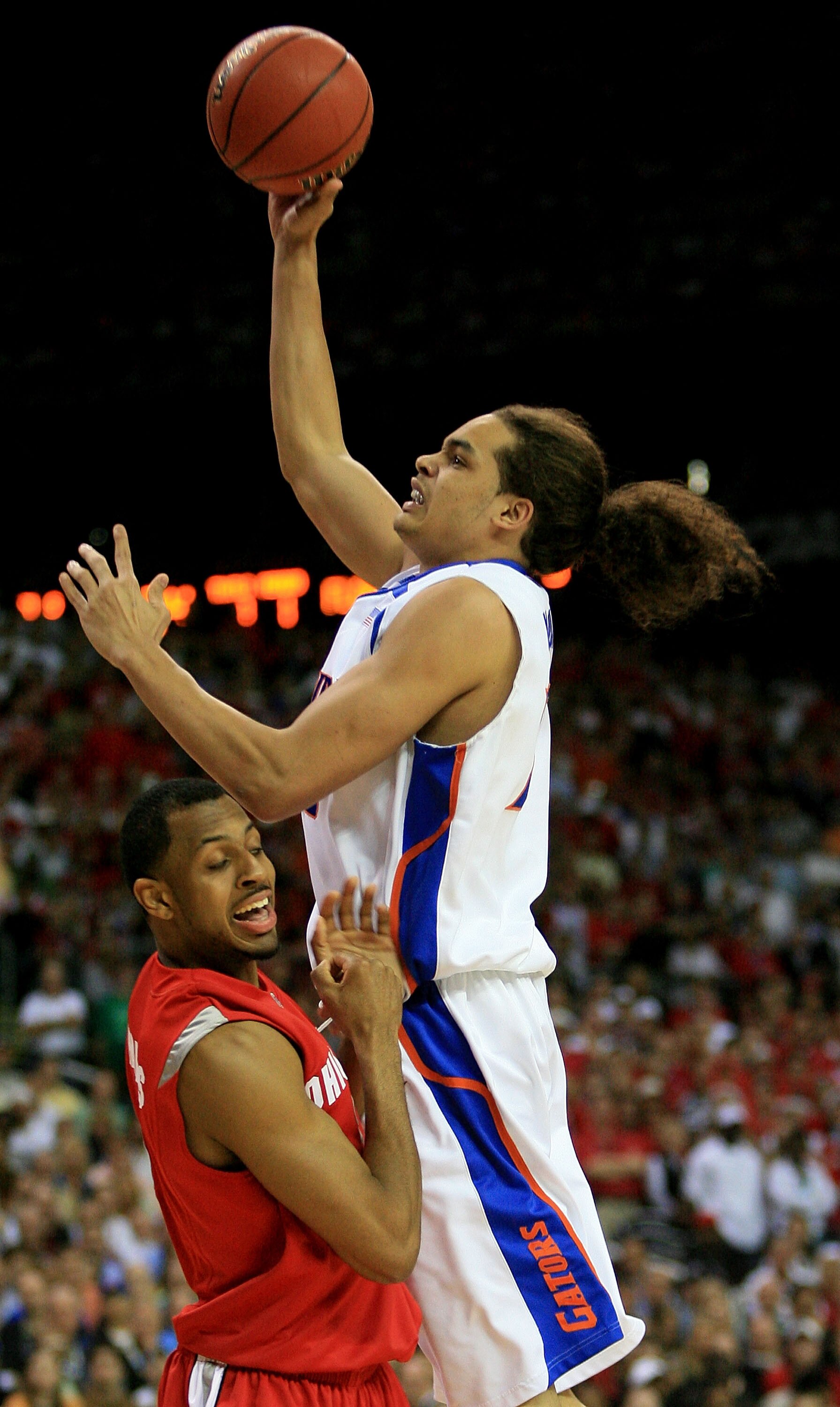 ATLANTA - APRIL 02:  Joakim Noah #13 of the Florida Gators goes to the hoop against Ron Lewis #12 of  the Ohio State Buckeyes in the NCAA Men's Basketball Championship game at the Georgia Dome on April 2, 2007 in Atlanta, Georgia.  (Photo by Streeter Leck