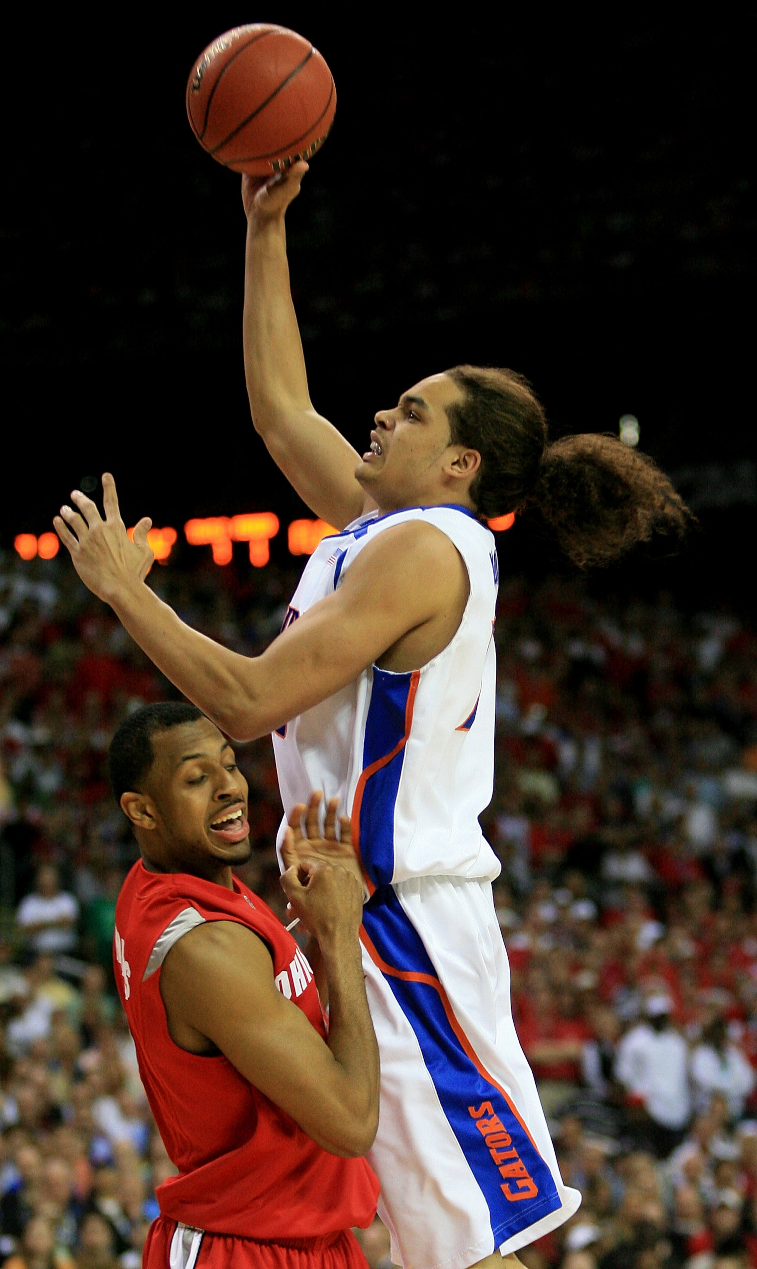 ATLANTA - APRIL 02:  Joakim Noah #13 of the Florida Gators goes to the hoop against Ron Lewis #12 of  the Ohio State Buckeyes in the NCAA Men's Basketball Championship game at the Georgia Dome on April 2, 2007 in Atlanta, Georgia.  (Photo by Streeter Leck