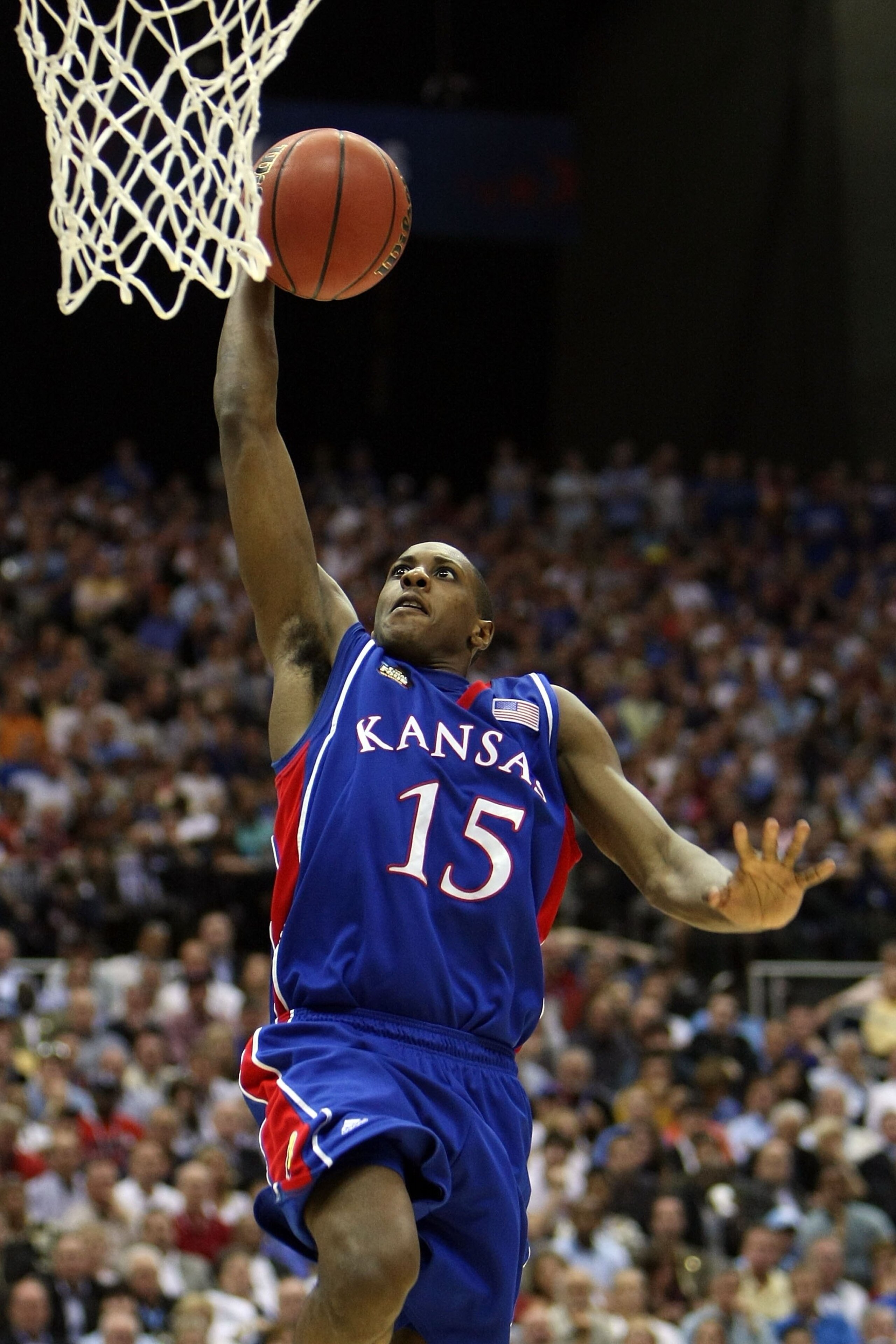 SAN ANTONIO - APRIL 05:  Mario Chalmers #15 of the Kansas Jayhawks goes up for a dunk while taking on the North Carolina Tar Heels during the National Semifinal game of the NCAA Men's Final Four at the Alamodome on April 5, 2008 in San Antonio, Texas.  (P