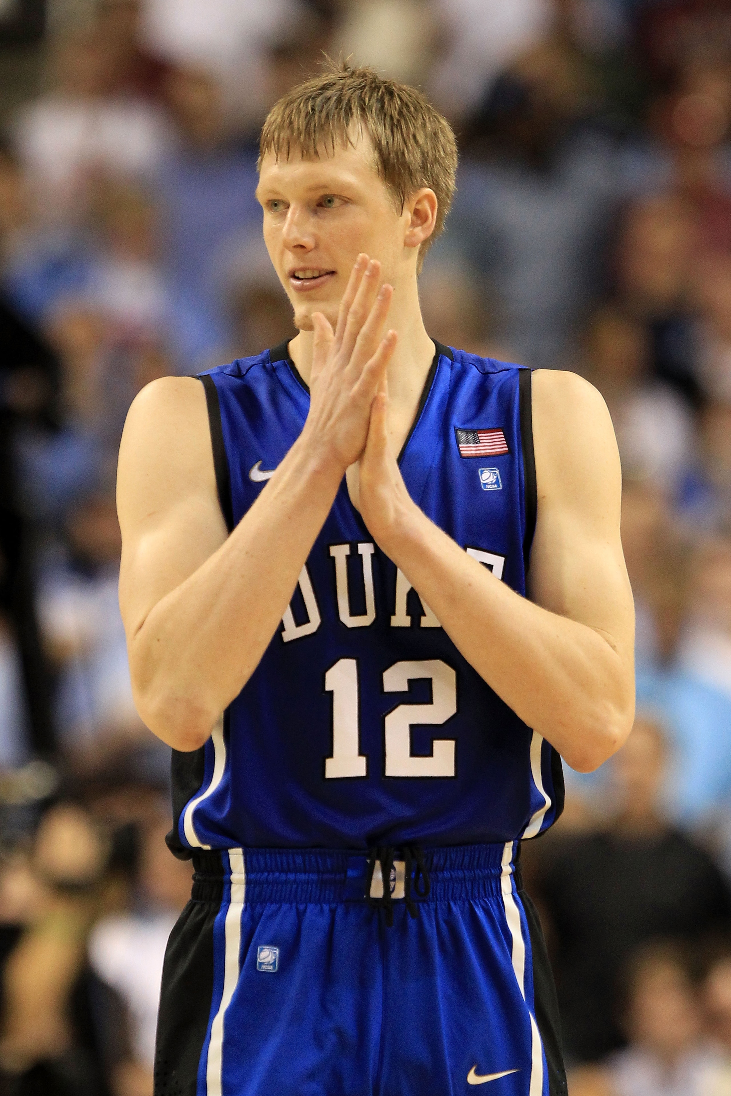 GREENSBORO, NC - MARCH 13:  Kyle Singler #12 of the Duke Blue Devils looks on during the first half of the game against the North Carolina Tar Heels in the championship game of the 2011 ACC men's basketball tournament at the Greensboro Coliseum on March 1