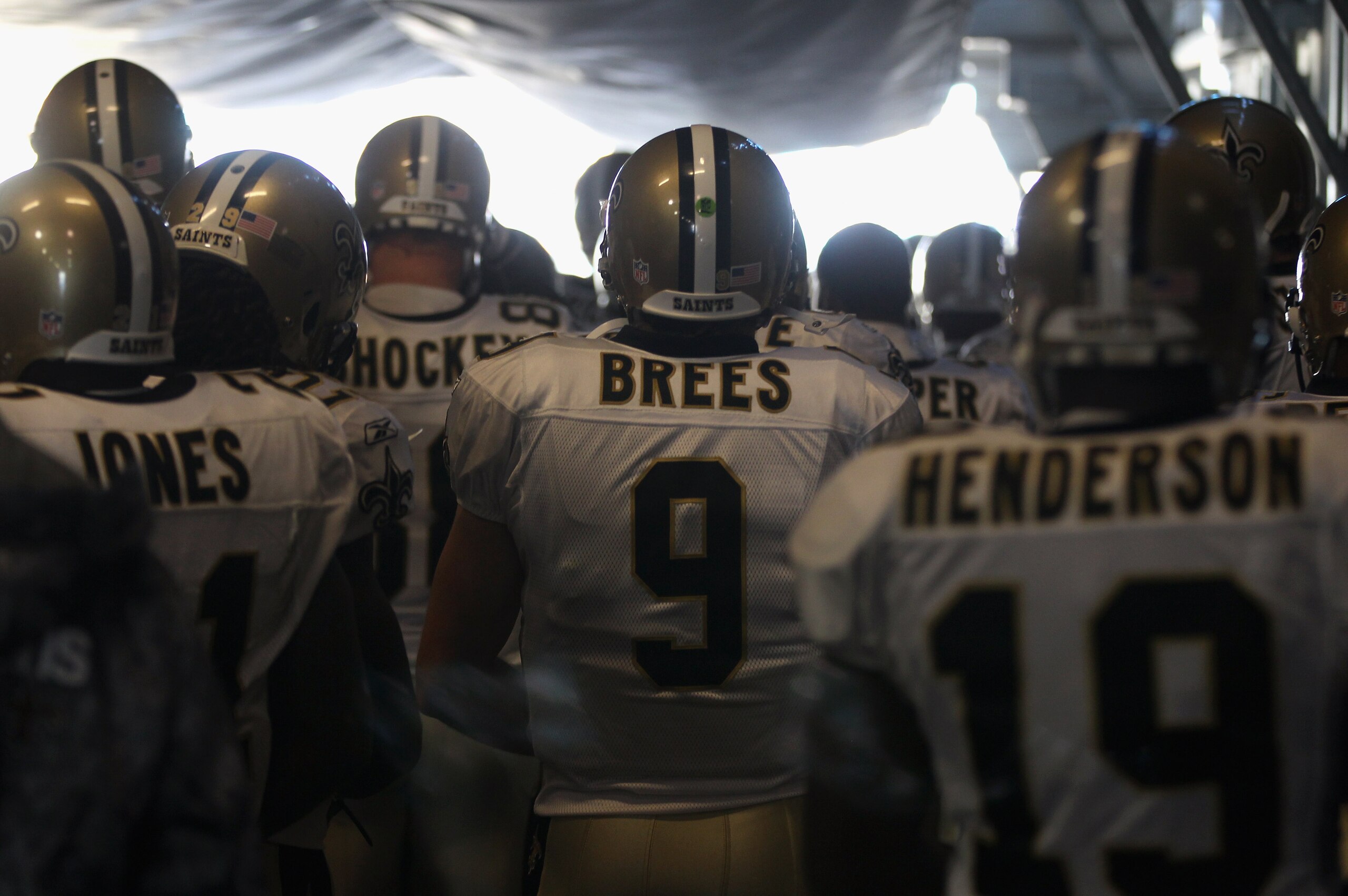 CHARLOTTE, NC - NOVEMBER 07:  Drew Brees #9 of the New Orleans Saints waits with his team during player introductions against the Carolina Panthers at Bank of America Stadium on November 7, 2010 in Charlotte, North Carolina.  (Photo by Streeter Lecka/Gett