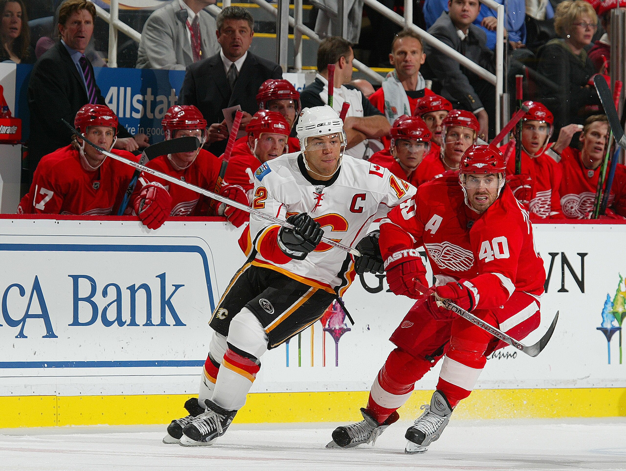 DETROIT - OCTOBER 10:  Jarome Iginla #12 of the Calgary Flames tries to check Henrik Zetterberg #40 of the Detroit Red Wings in a game on October 10, 2007 at the Joe Louis Arena in Detroit, Michigan. The Red Wings defeated the Flames 4-2. (Photo by Claus