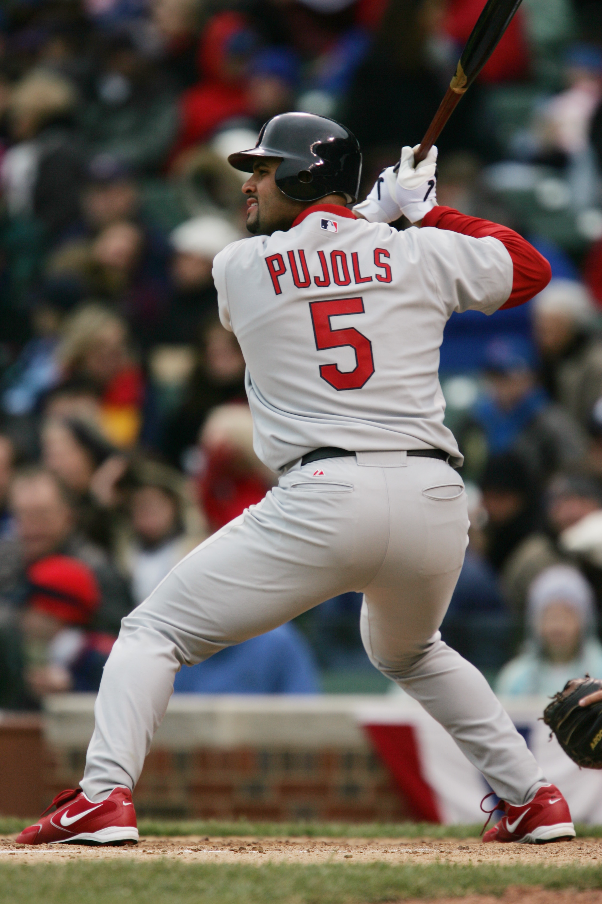 CHICAGO - APRIL 7:  Albert Pujols #5 of the St. Louis Cardinals bats against the Chicago Cubs during the home opener at Wrigley Field on April 7, 2006 in Chicago, Illinois. The Cubs defeated the Cardinals 5-1.  (Photo by Jonathan Daniel/Getty Images)