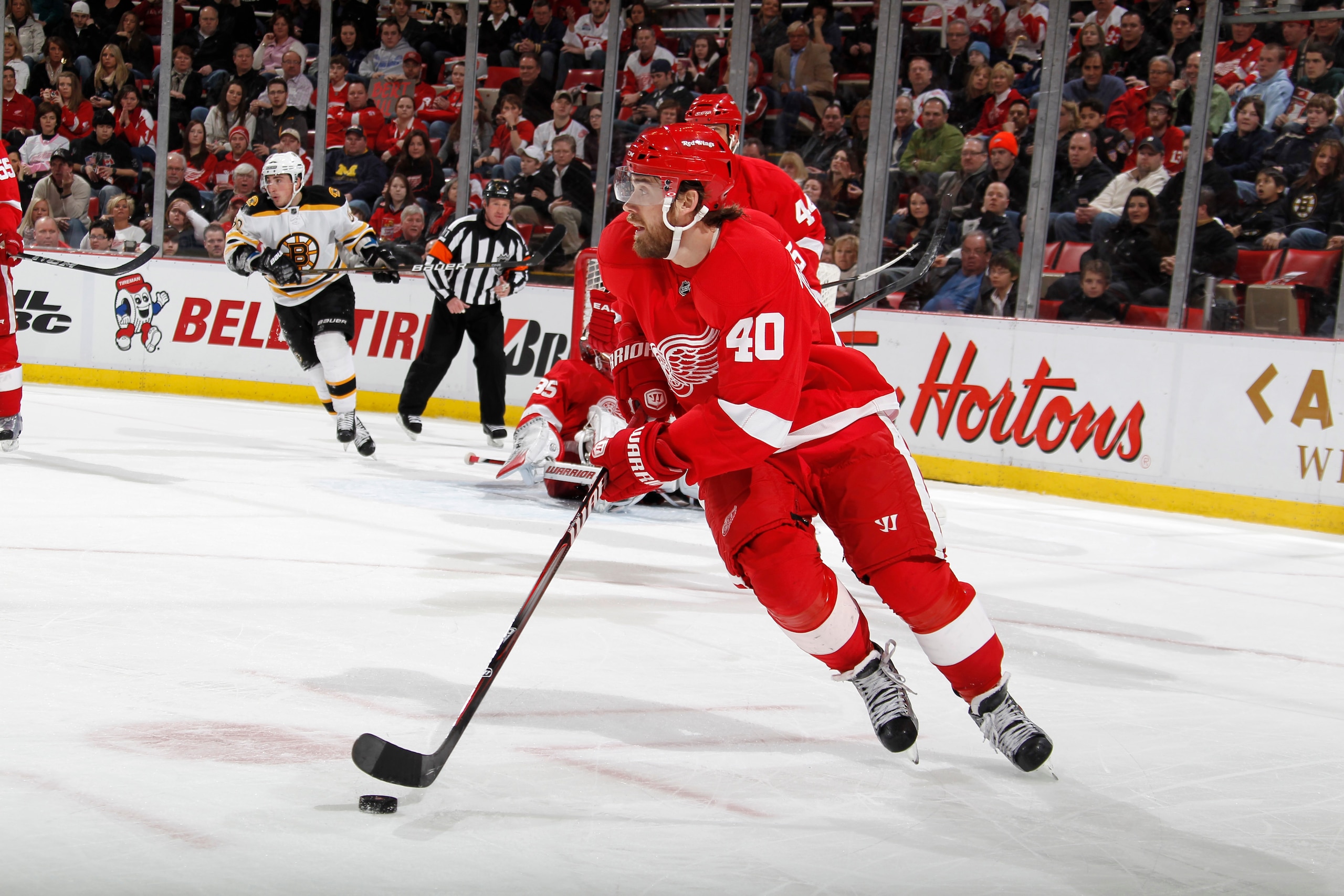 DETROIT, MI - FEBRUARY 13:  Henrik Zeterberg #40 of the Detroit Red Wings skates with the puck against the Boston Bruins on February 13, 2011 in Detroit, Michigan.  (Photo by Gregory Shamus/Getty Images)