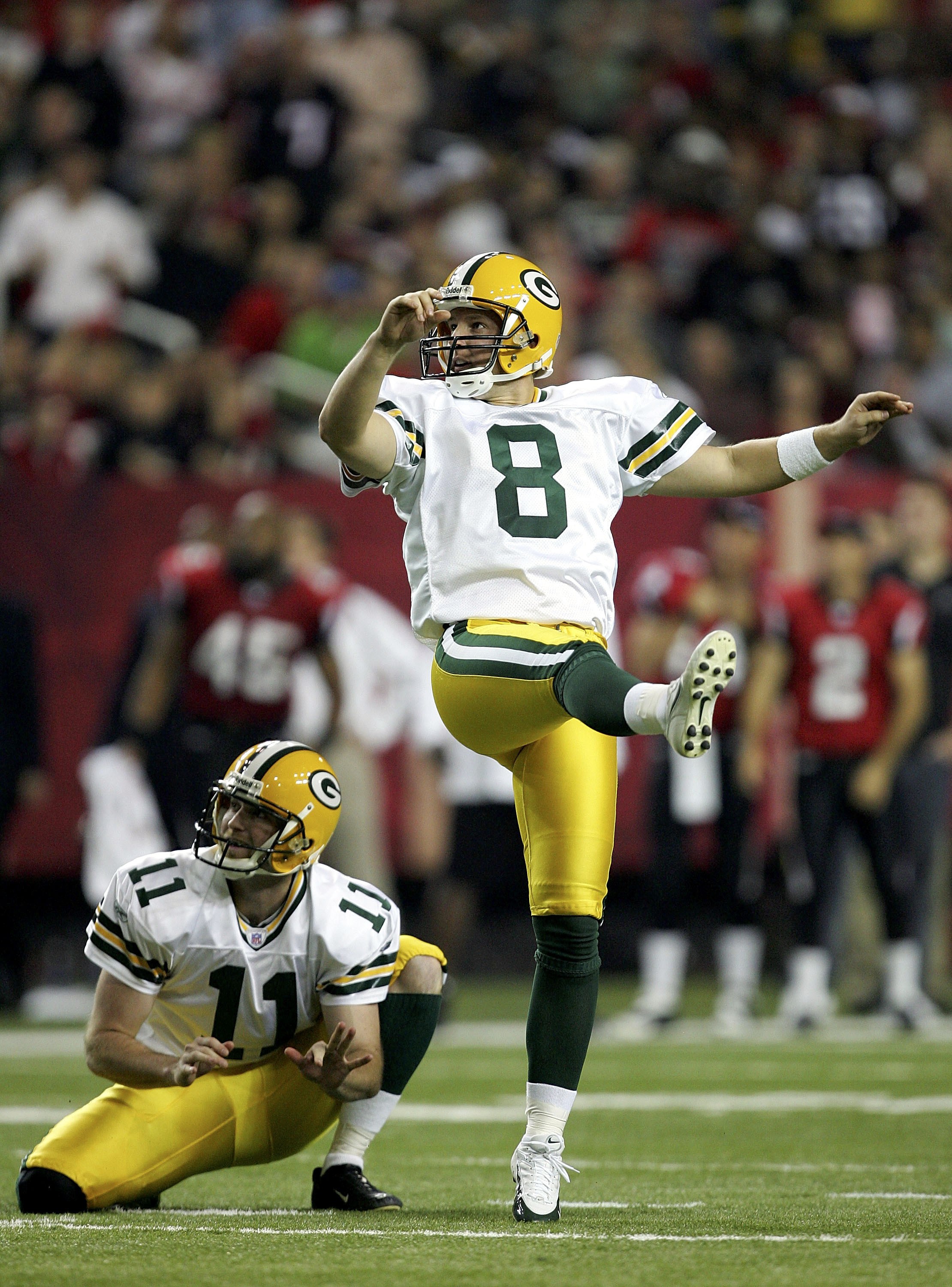 ATLANTA - NOVEMBER 13:  Ryan Longwell #8 of the Green Bay Packers watches a kick with teammate B.J. Sander #11 during their game against the Atlanta Falcons on November 13, 2005 at the Georgia Dome in Atlanta, Georgia.  (Photo by Streeter Lecka/Getty Imag